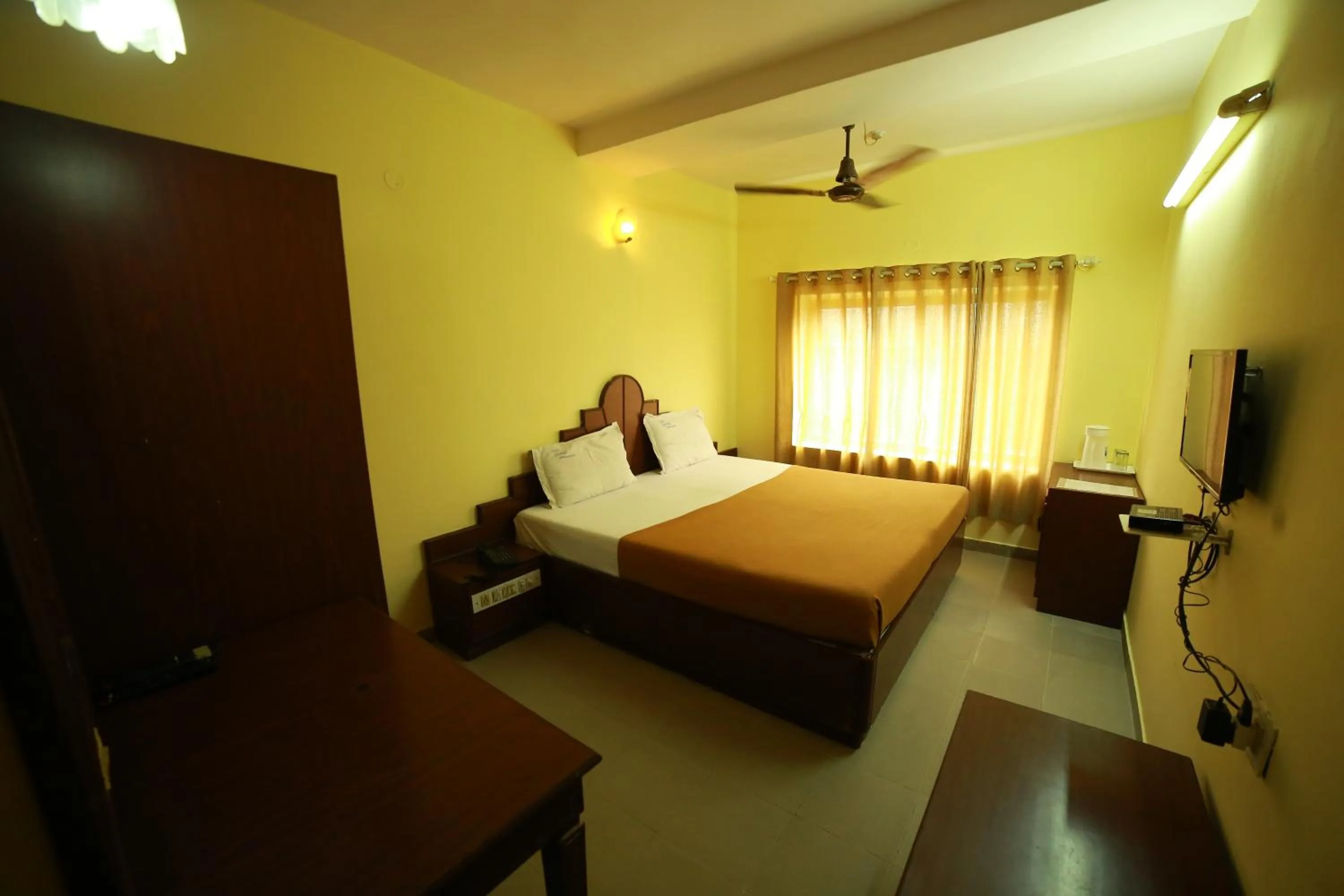 Bedroom in Luciya International Mysore