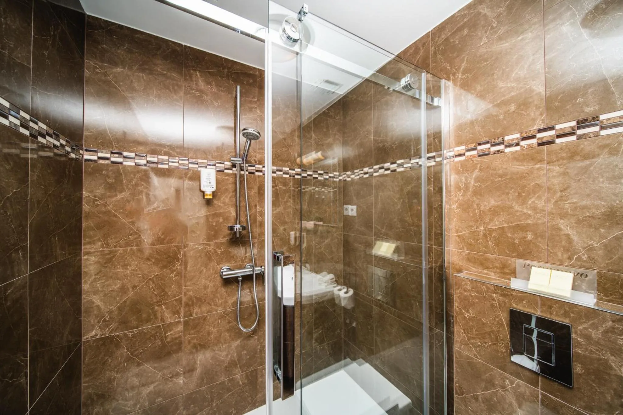 Shower in SUNce Palace Apartments with free offsite parking