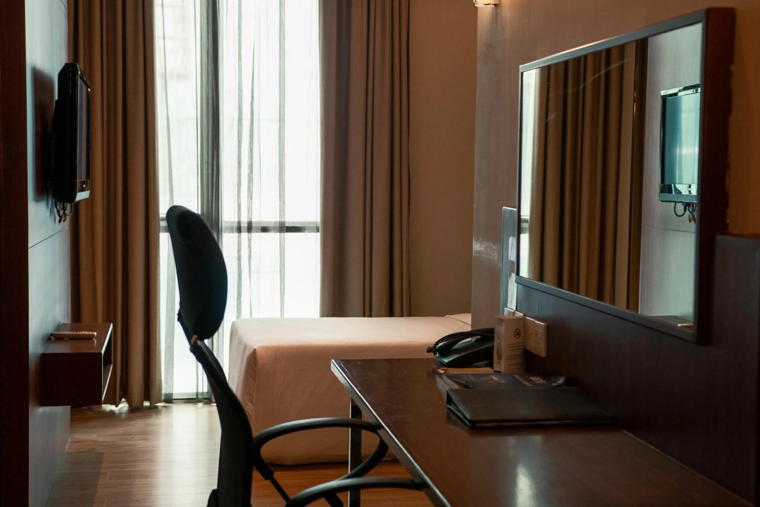 Bed in Swiss Hotel Apartment