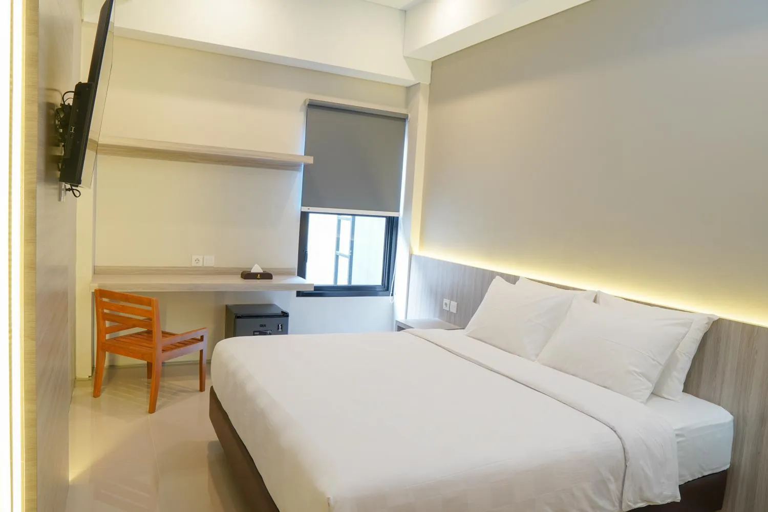 Bed in Sajiwa Inn and Suite Hotel