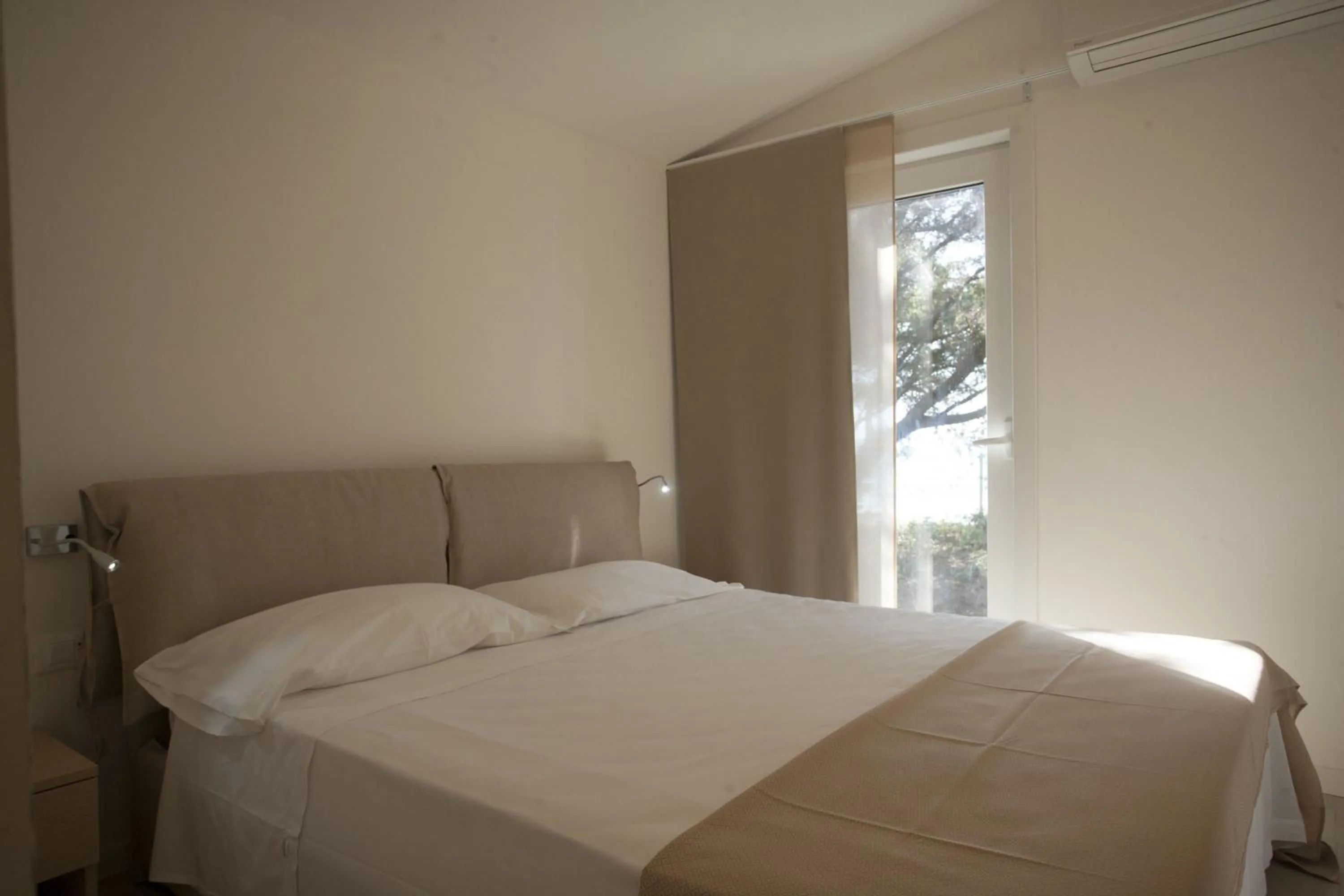 Bed in PuntAla Camp & Resort