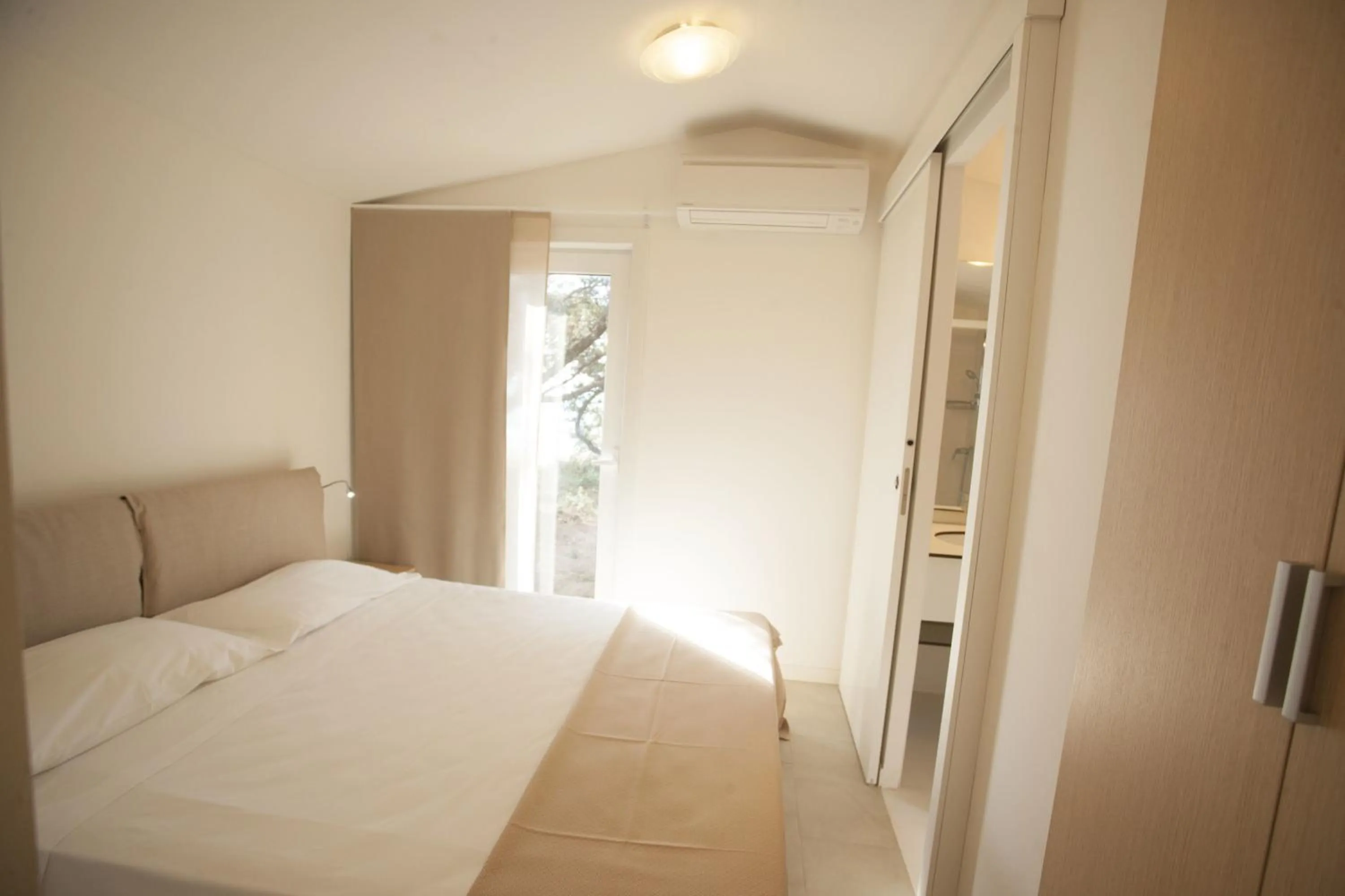 Bed in PuntAla Camp & Resort