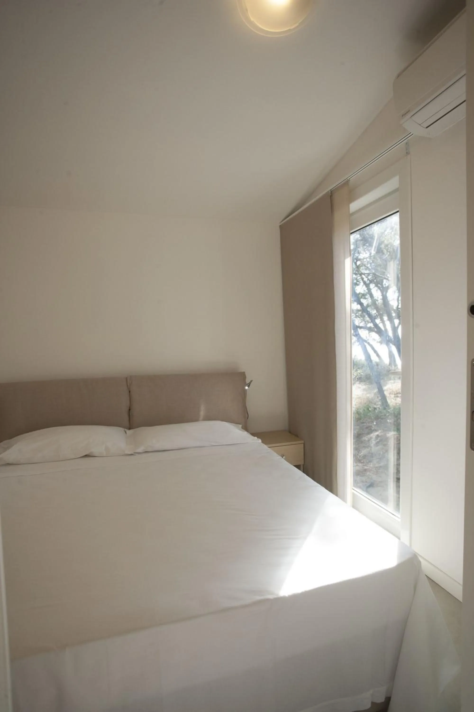 Bed in PuntAla Camp & Resort