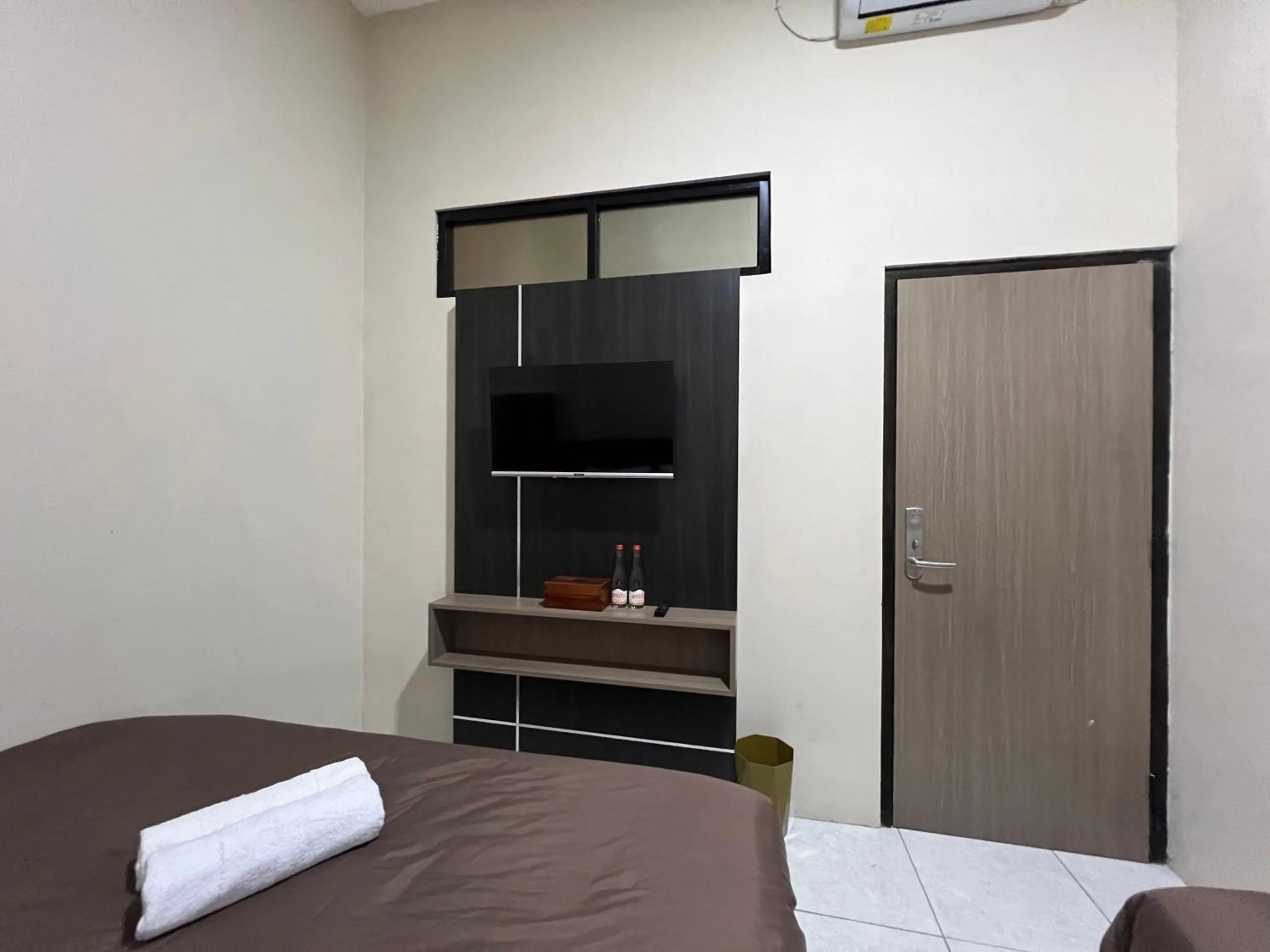 Bed in Brenn Hotel Semarang Mitra Reddoorz