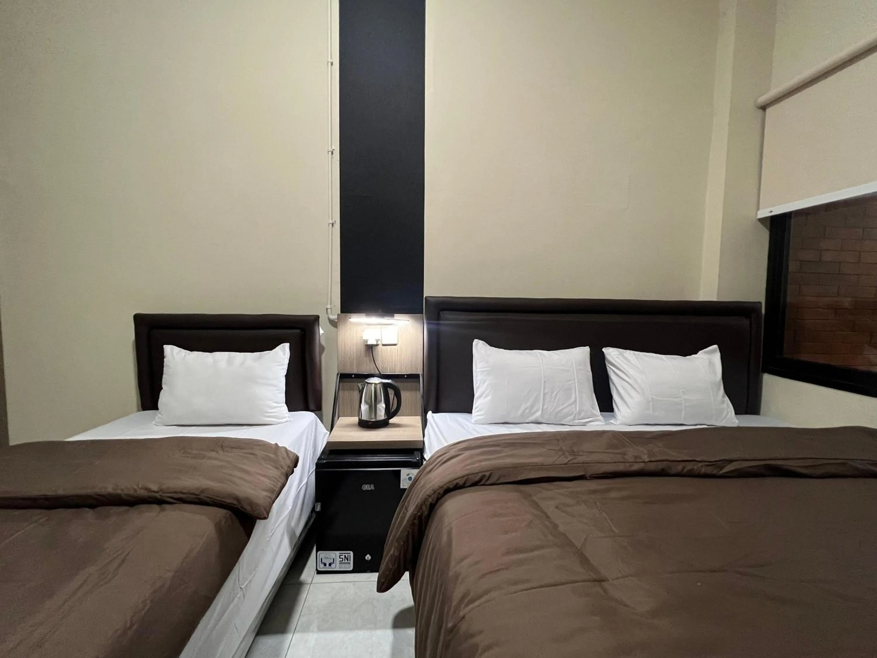 Bed in Brenn Hotel Semarang Mitra Reddoorz
