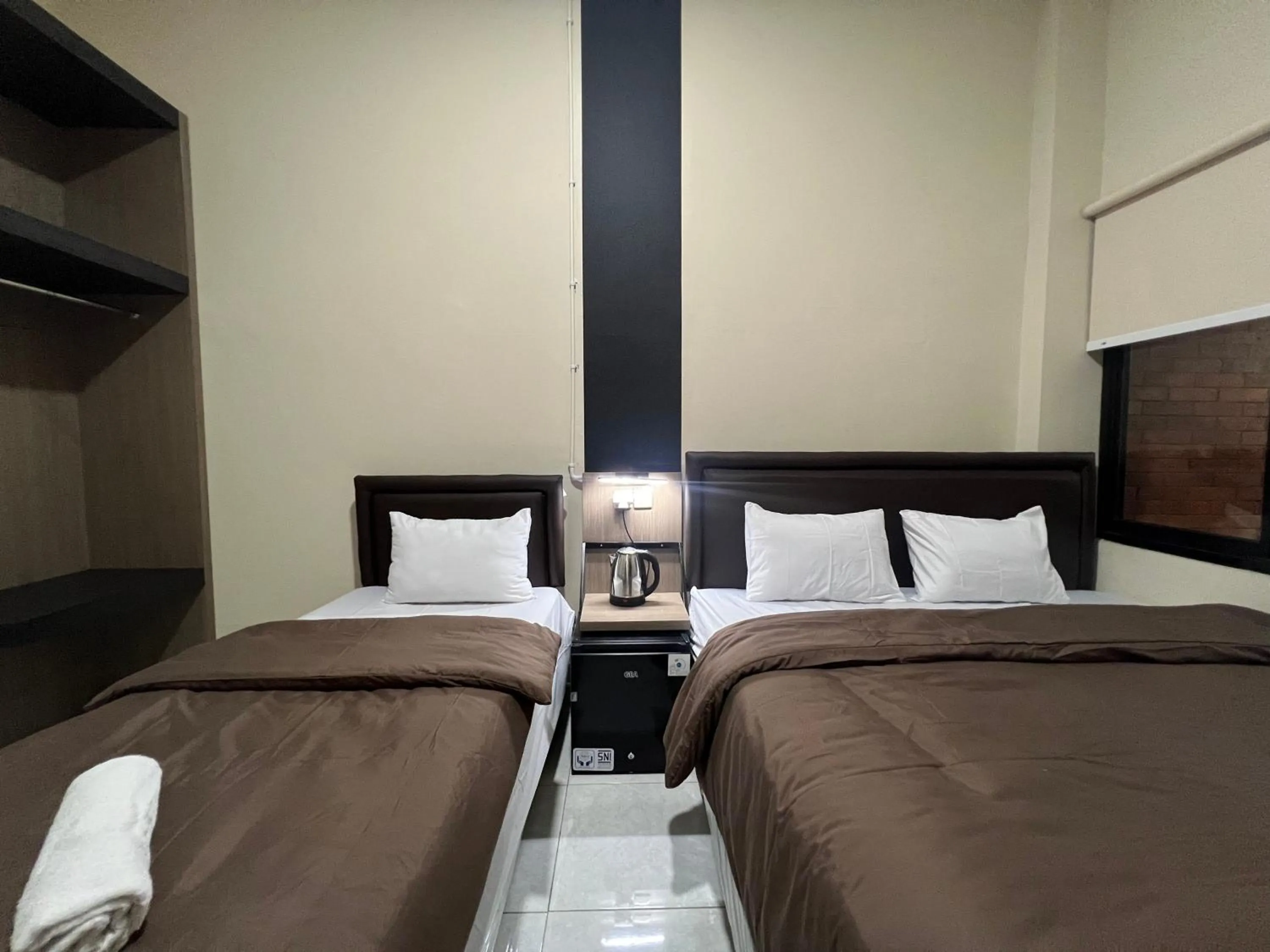 Bed in Brenn Hotel Semarang Mitra Reddoorz