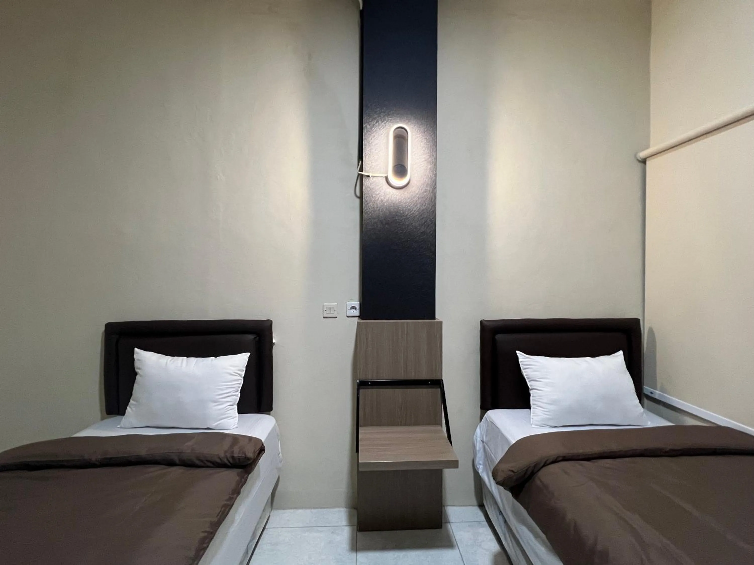 Bed in Brenn Hotel Semarang Mitra Reddoorz