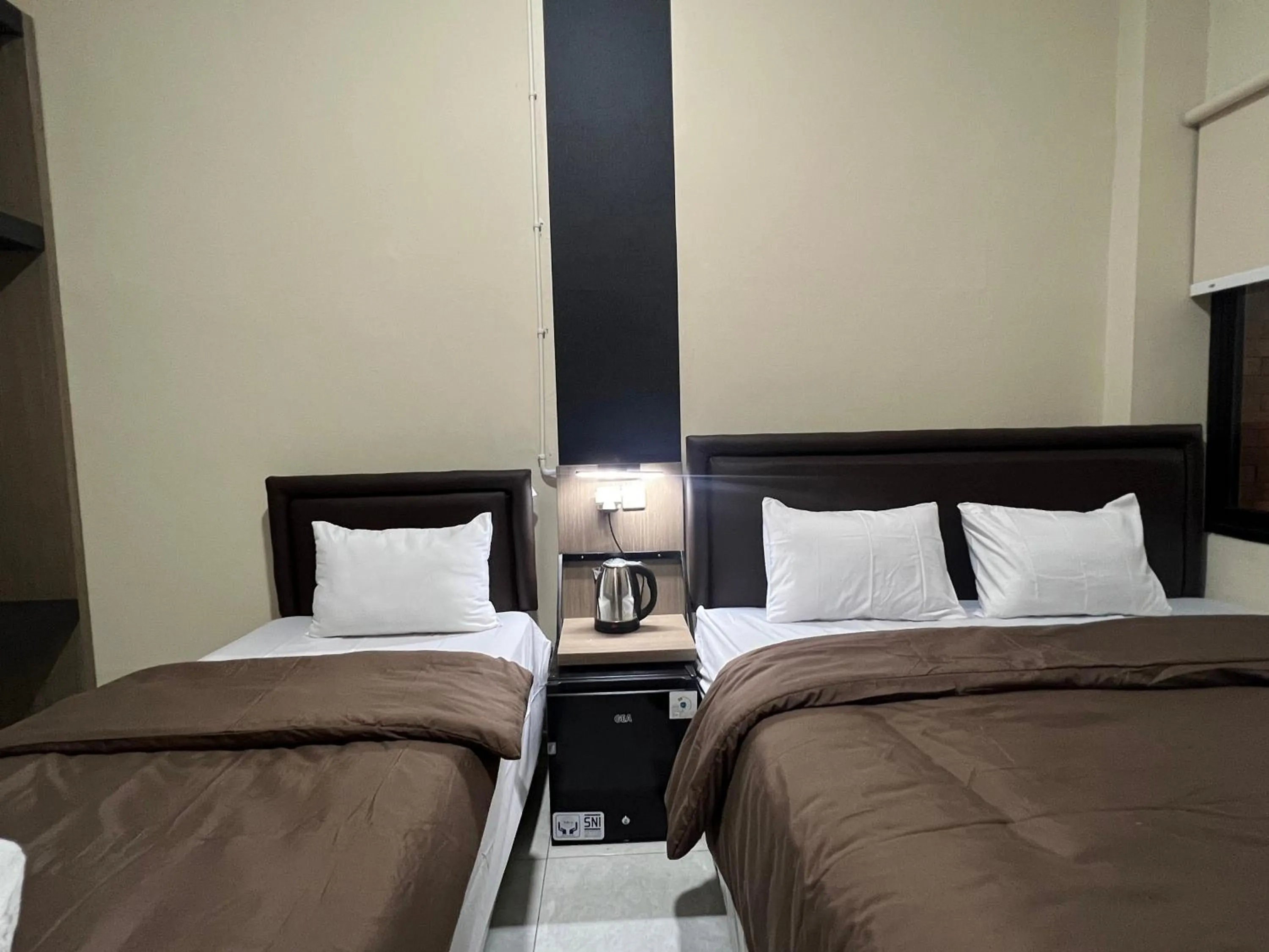 Bed in Brenn Hotel Semarang Mitra Reddoorz