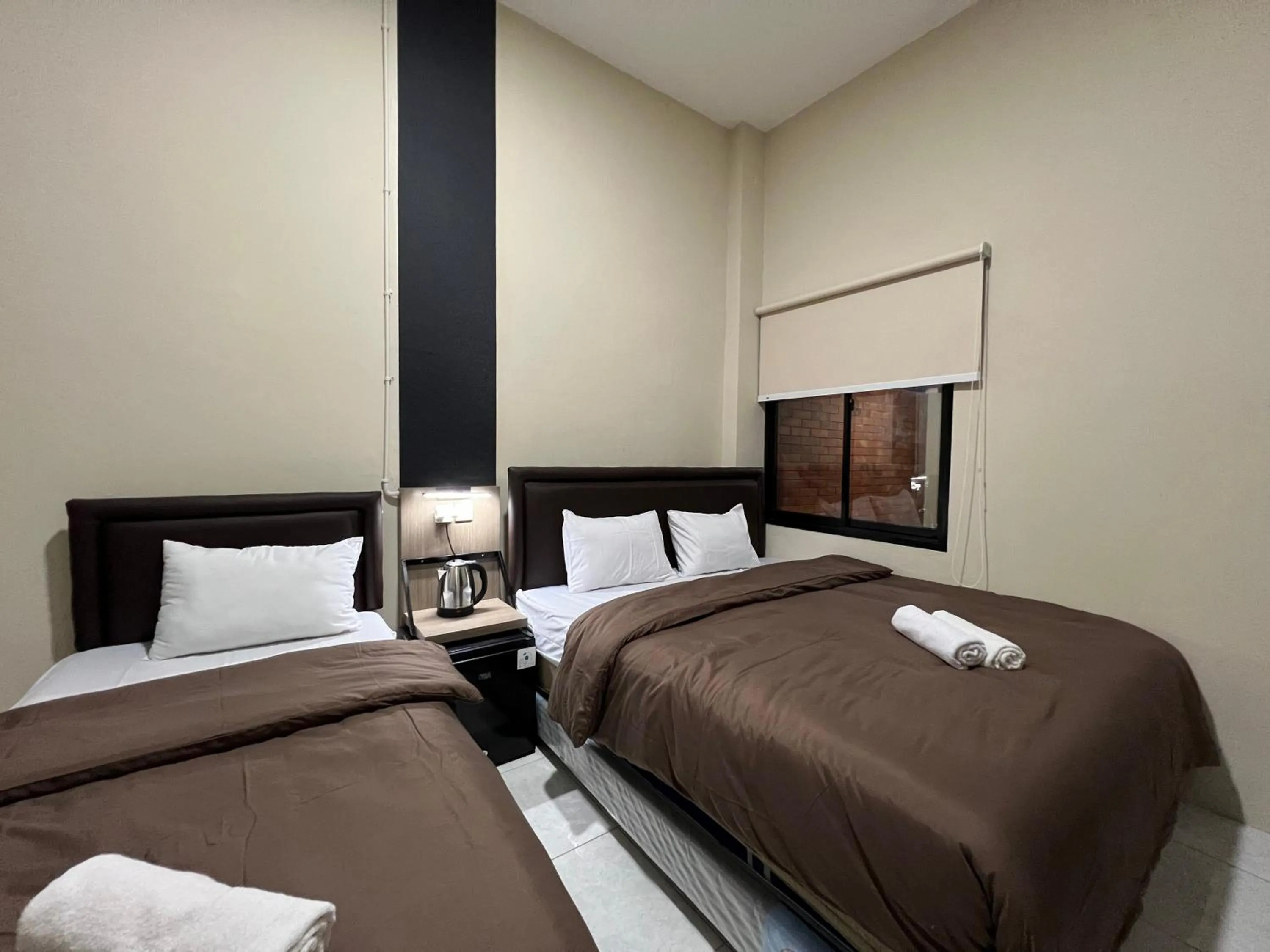 Bed in Brenn Hotel Semarang Mitra Reddoorz