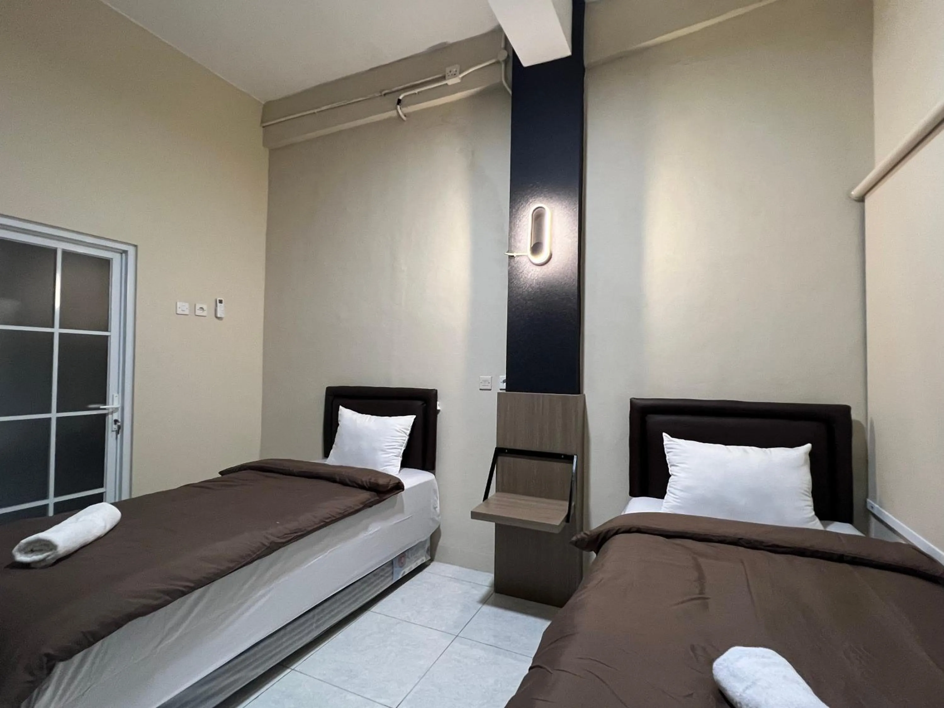 Bed in Brenn Hotel Semarang Mitra Reddoorz