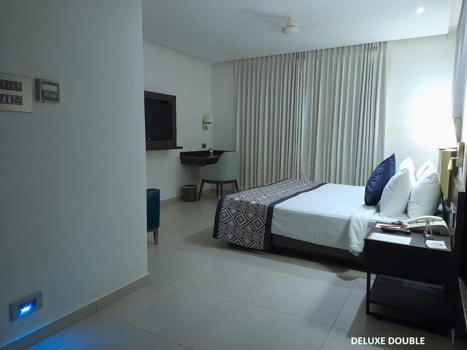 Bed in Grand Continent Malleshwaram A Sarovar Portico Affiliate Hotel