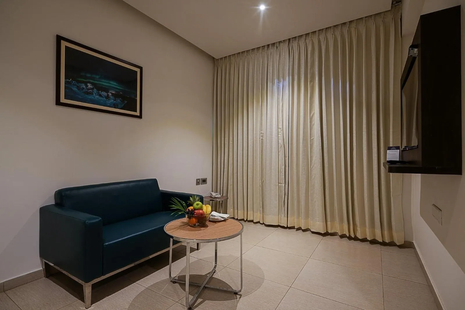 Living room in Grand Continent Malleshwaram A Sarovar Portico Affiliate Hotel