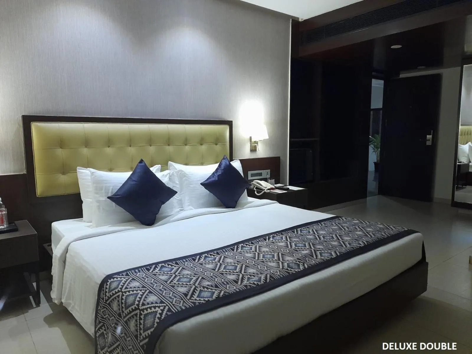 Bed in Grand Continent Malleshwaram A Sarovar Portico Affiliate Hotel