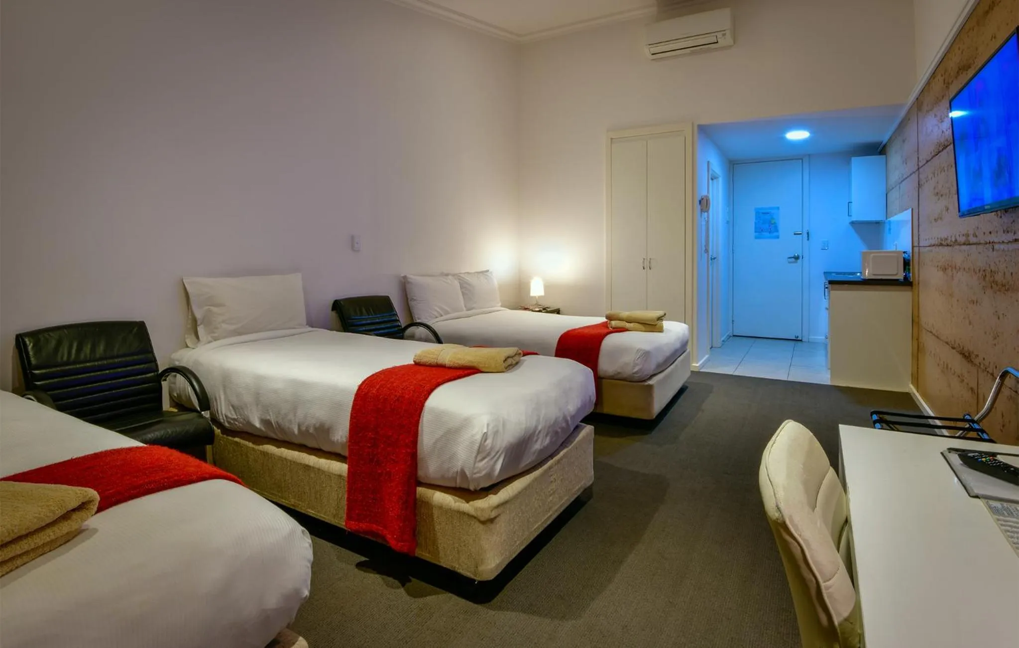 Bed in Crossroads Ecomotel