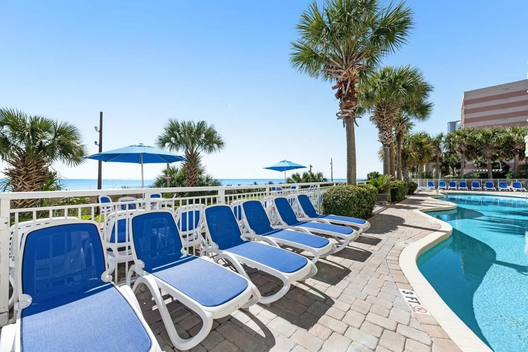 Pool view in Camelot By The Sea - Blue Palmetto Vacation Rentals