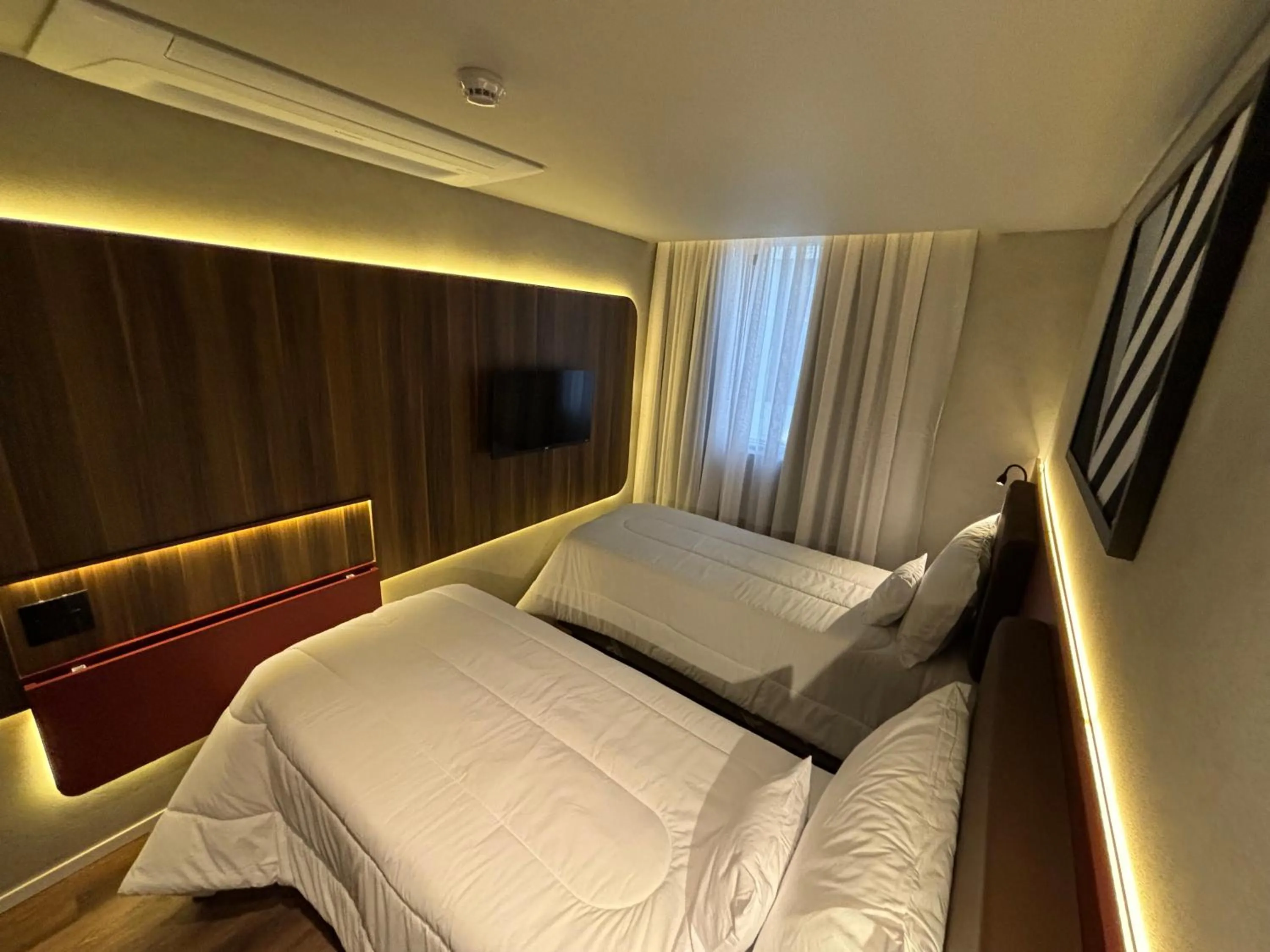 Bed in Golden Tower Express Nações Unidas by Fênix Hotéis