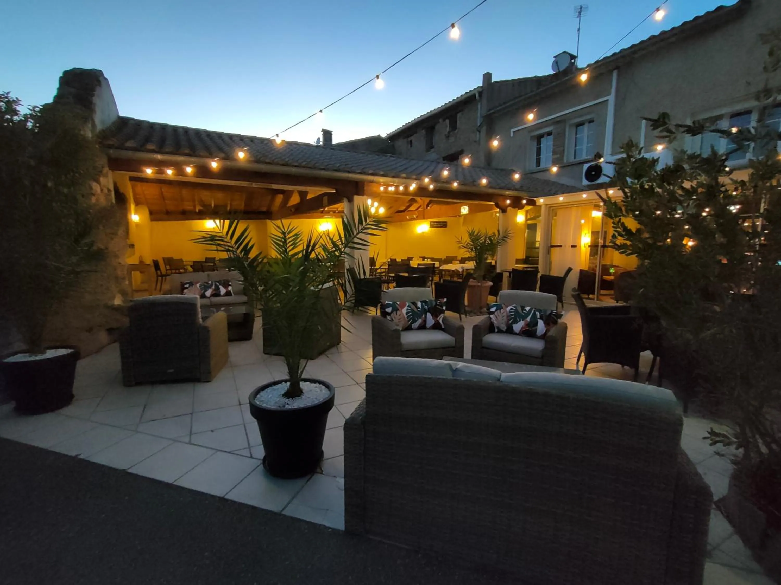 Patio in Hôtel Restaurant L'Art des Mets by Côté Jardin
