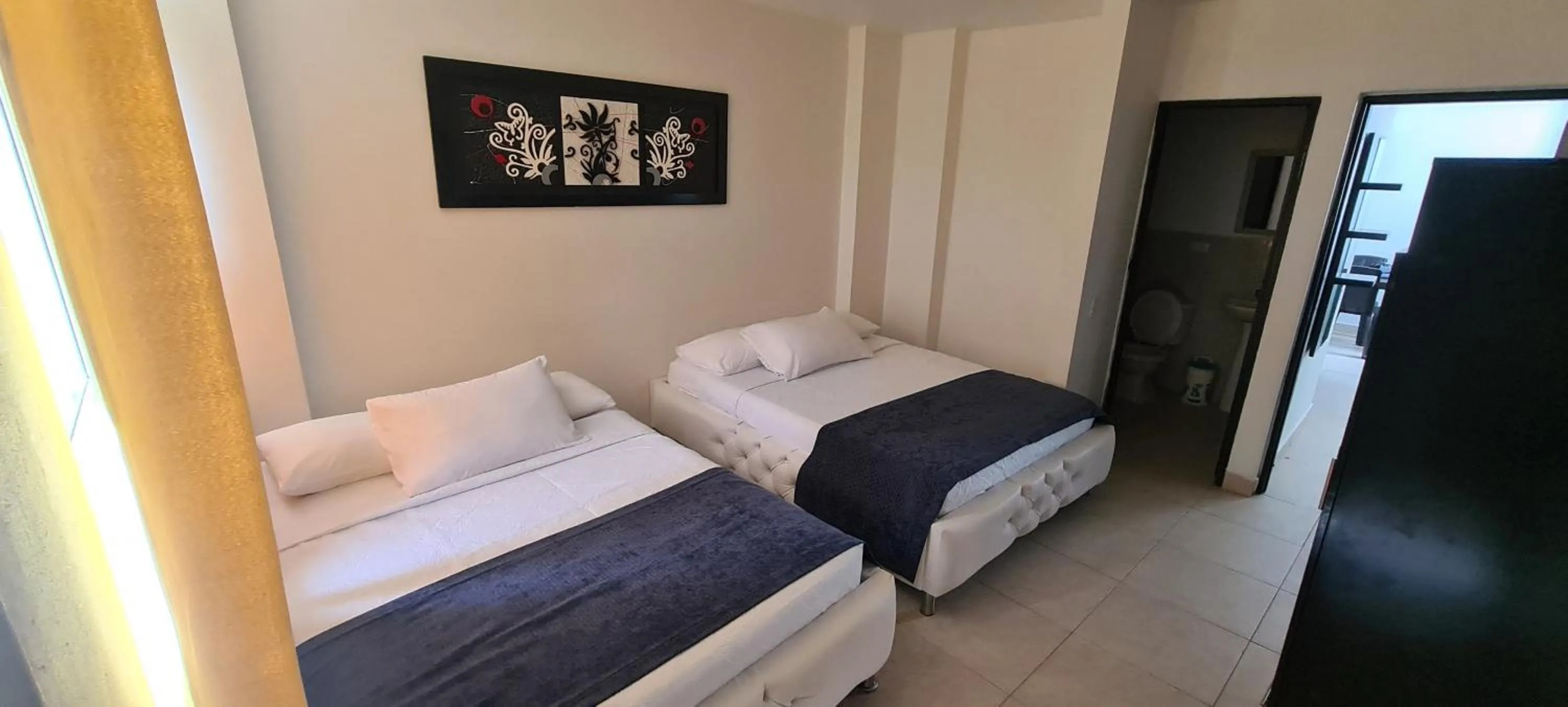 Photo of the whole room, Bed in Caribbean Island Hotel