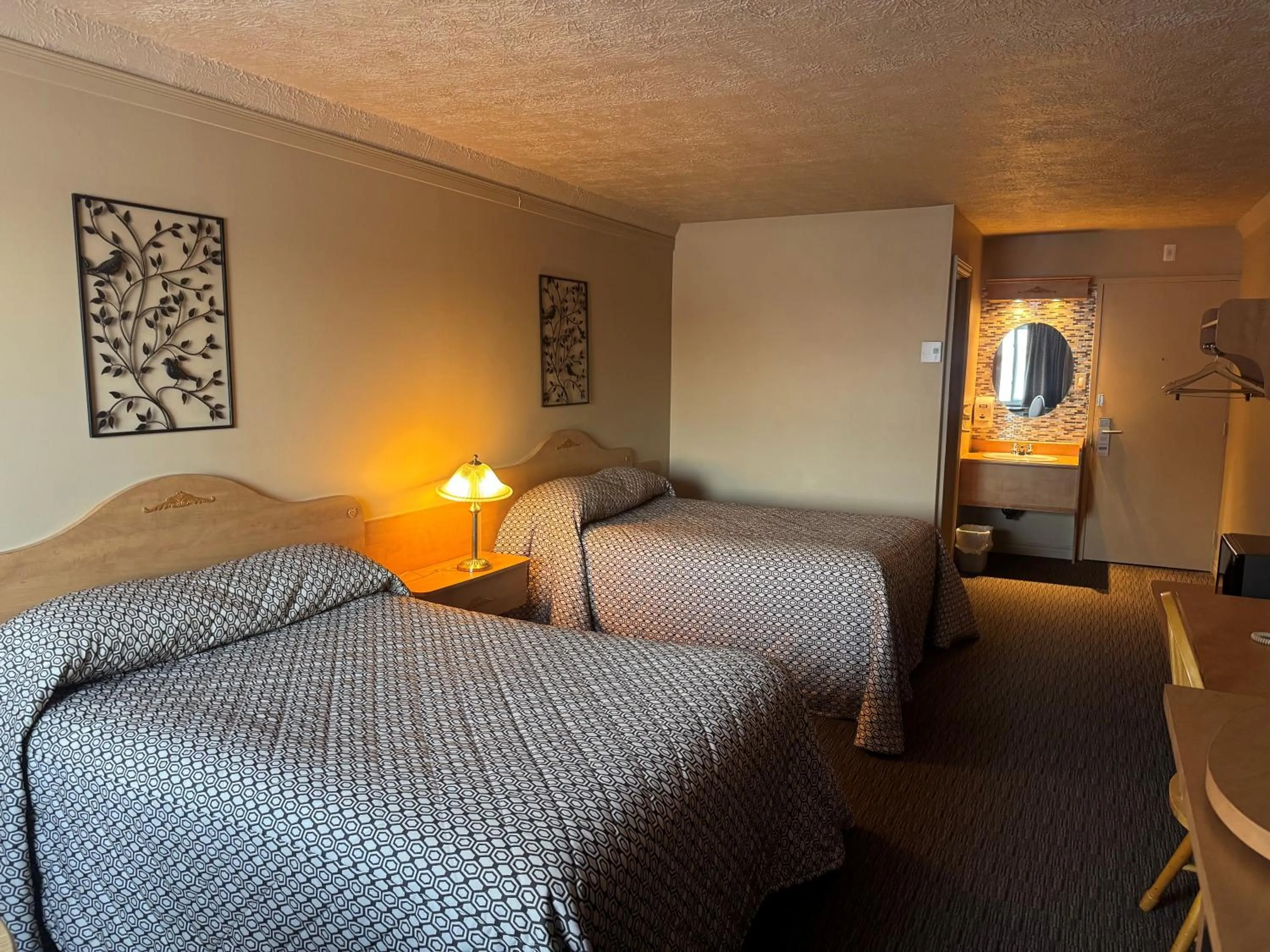 Bed in Travelodge by Wyndham Drummondville