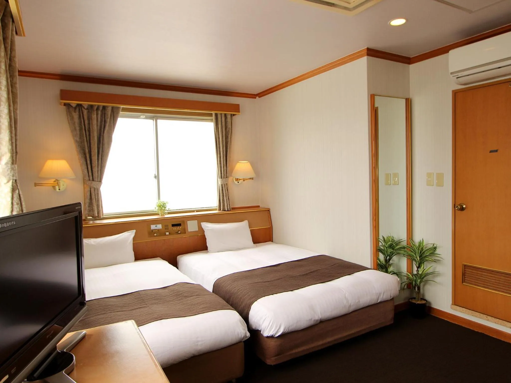 Photo of the whole room in HOTEL LiVEMAX BUDGET Okinawa Tomariko