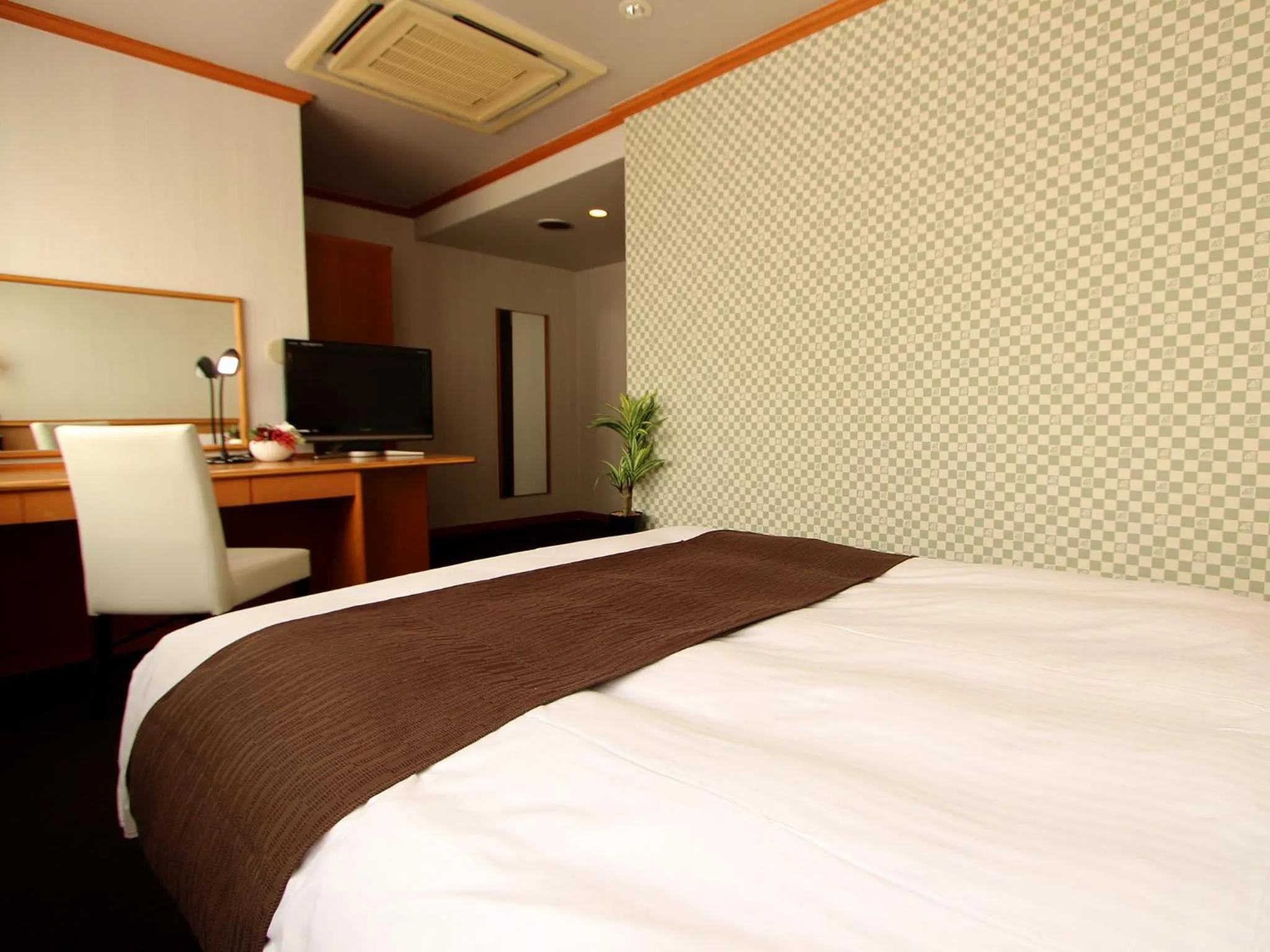 Photo of the whole room in HOTEL LiVEMAX BUDGET Okinawa Tomariko