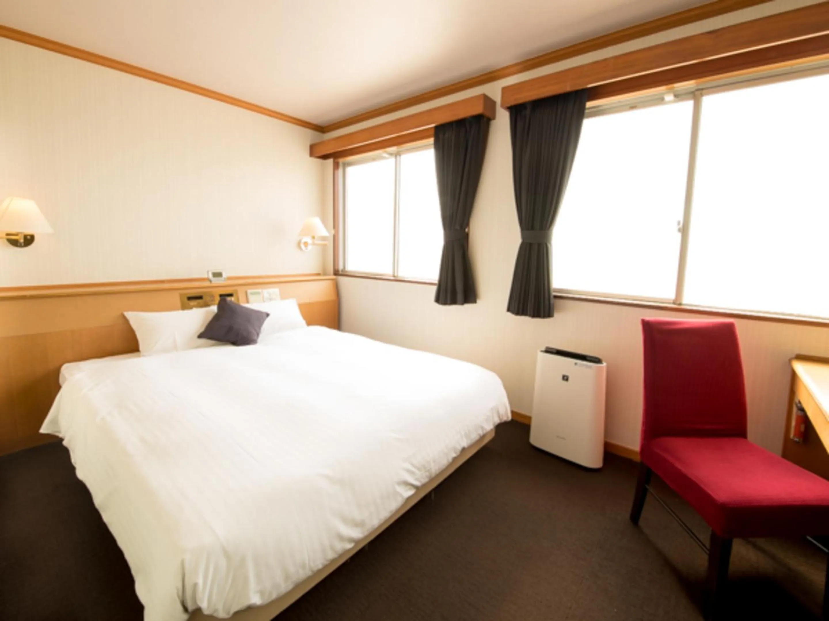 Bed in HOTEL LiVEMAX BUDGET Okinawa Tomariko