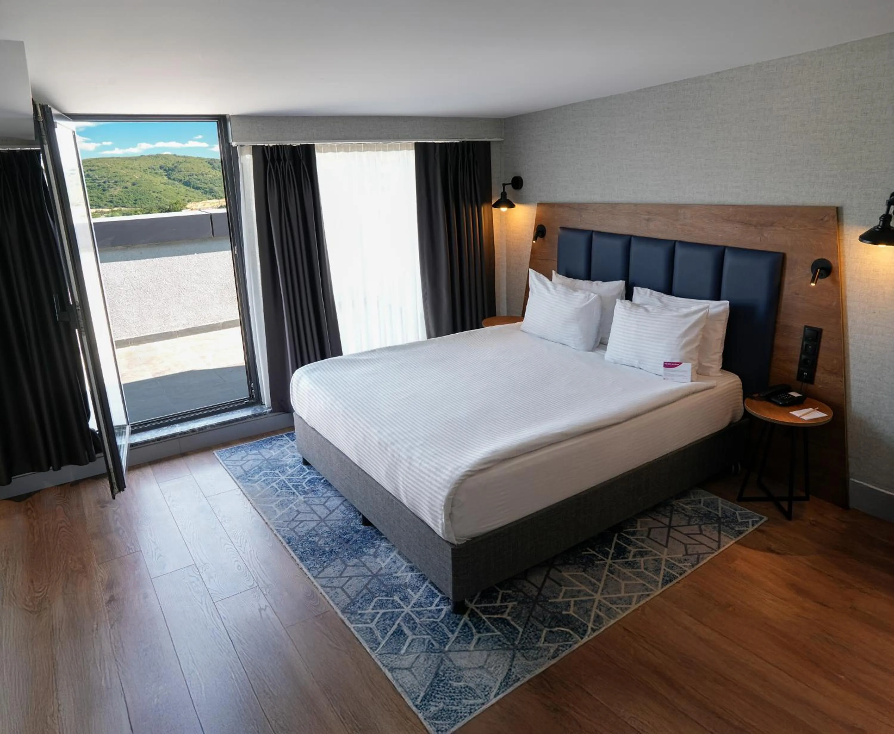 Bed in Ramada Encore by Wyndham Istanbul Arnavutkoy
