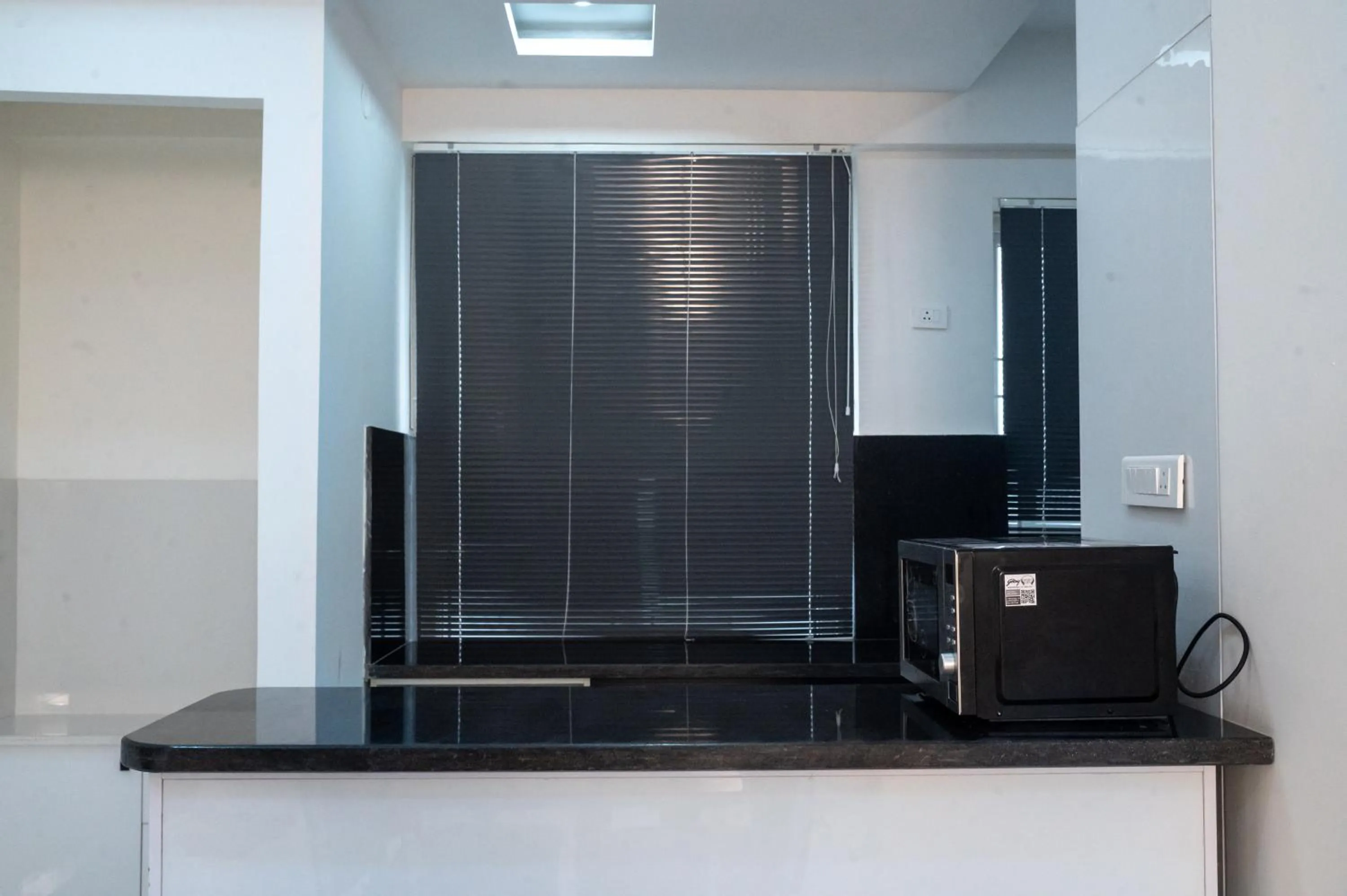 Kitchen or kitchenette in The Balcony Suites