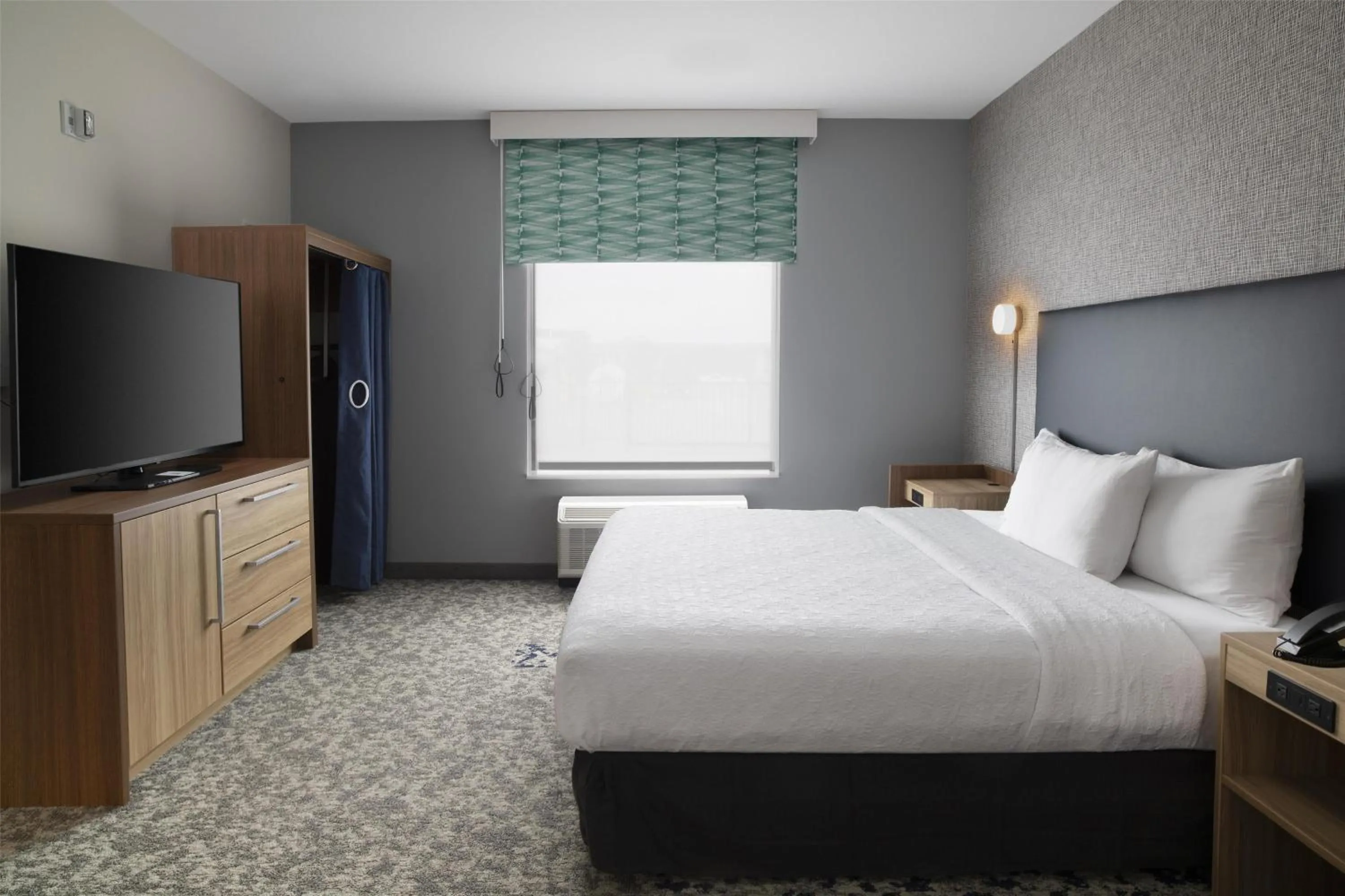 Bed in Home2 Suites By Hilton Dallas East