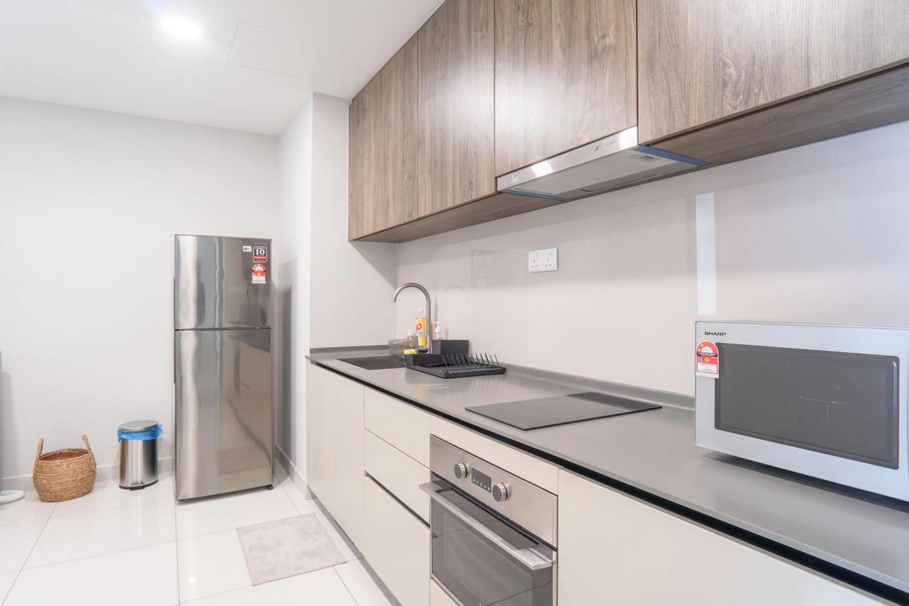 kitchen in Datum Jelatek Residence by Airhost