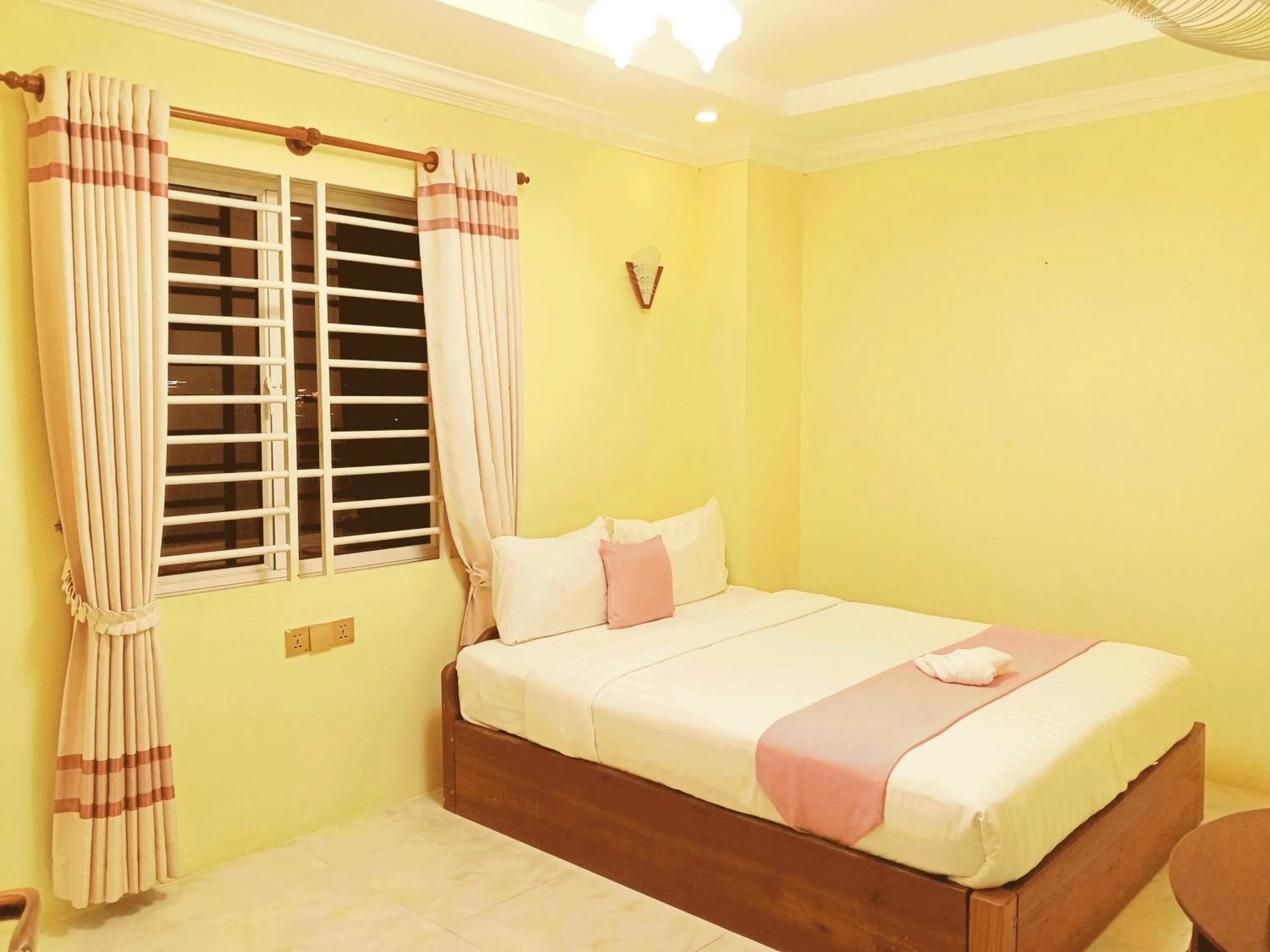 Bed in AHHA Boutique Kampot