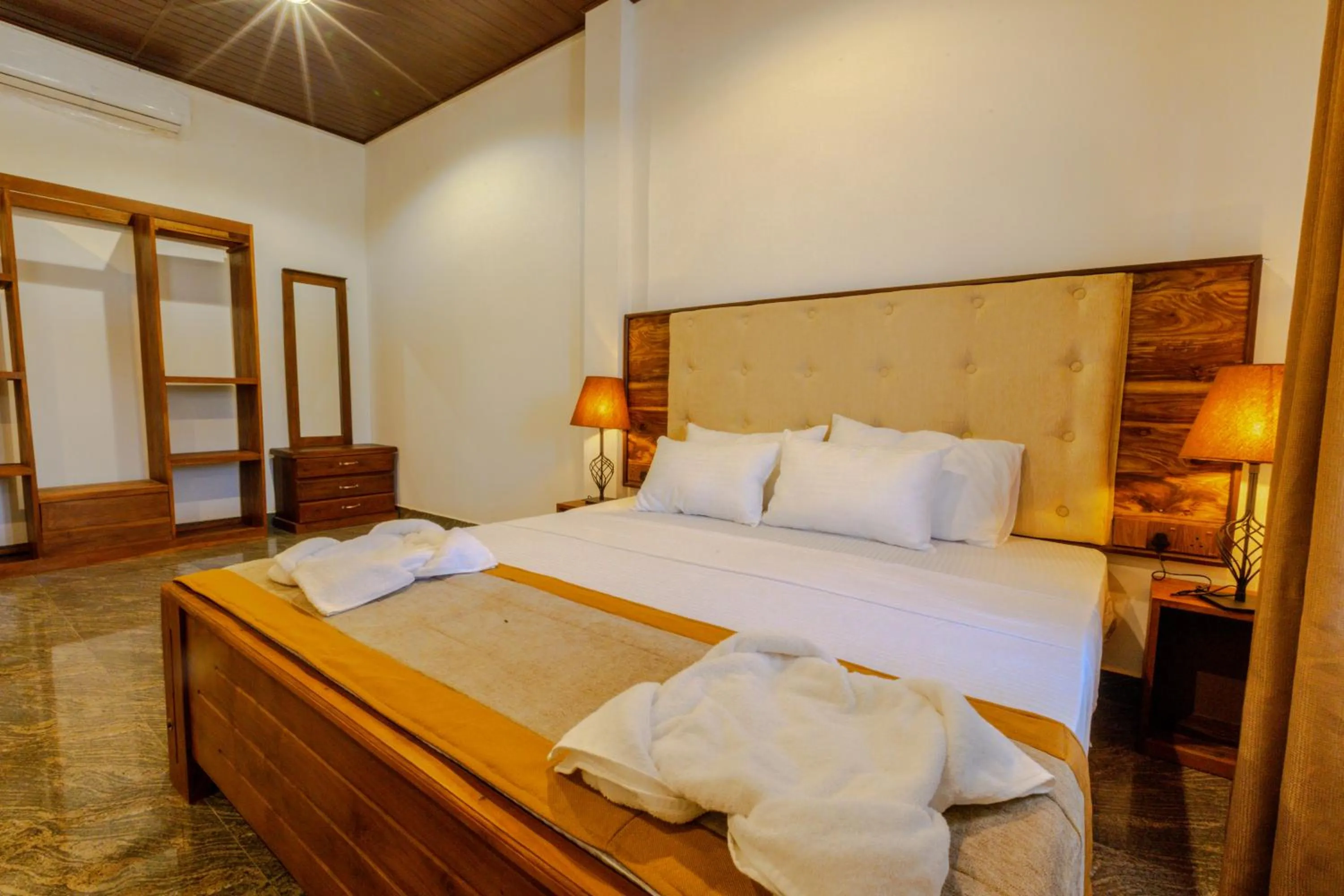 Bed in Elysia Sigiriya Hotel