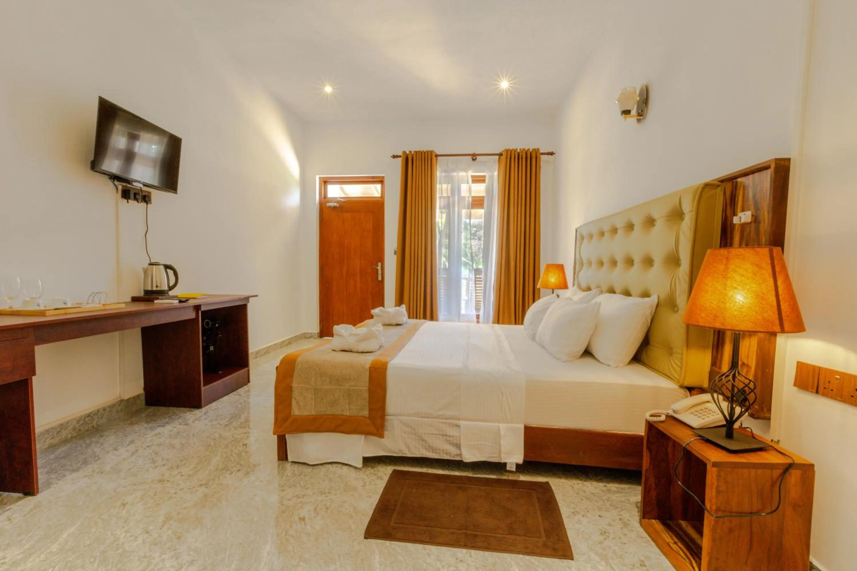 Bed in Elysia Sigiriya Hotel