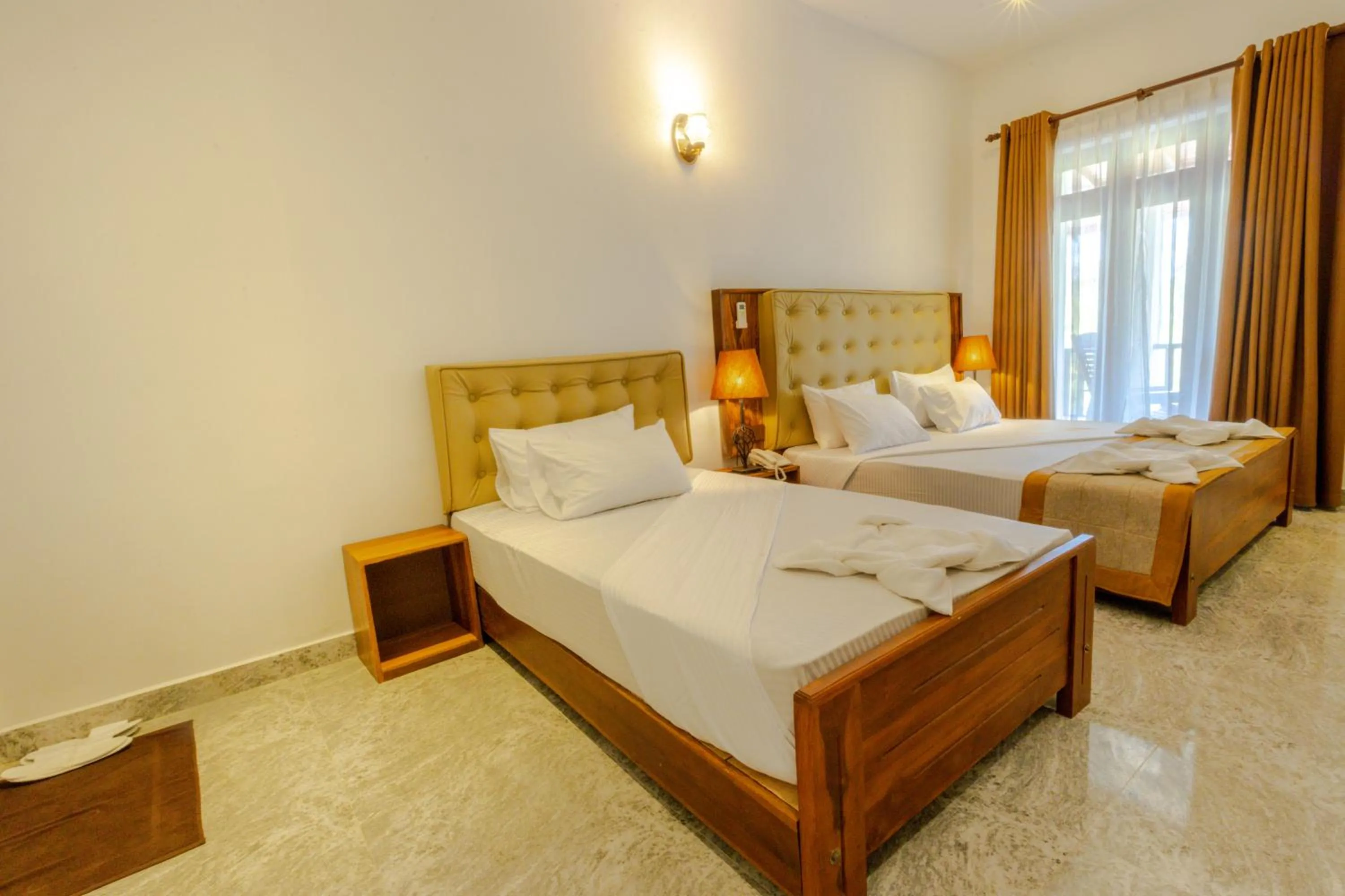 Bed in Elysia Sigiriya Hotel