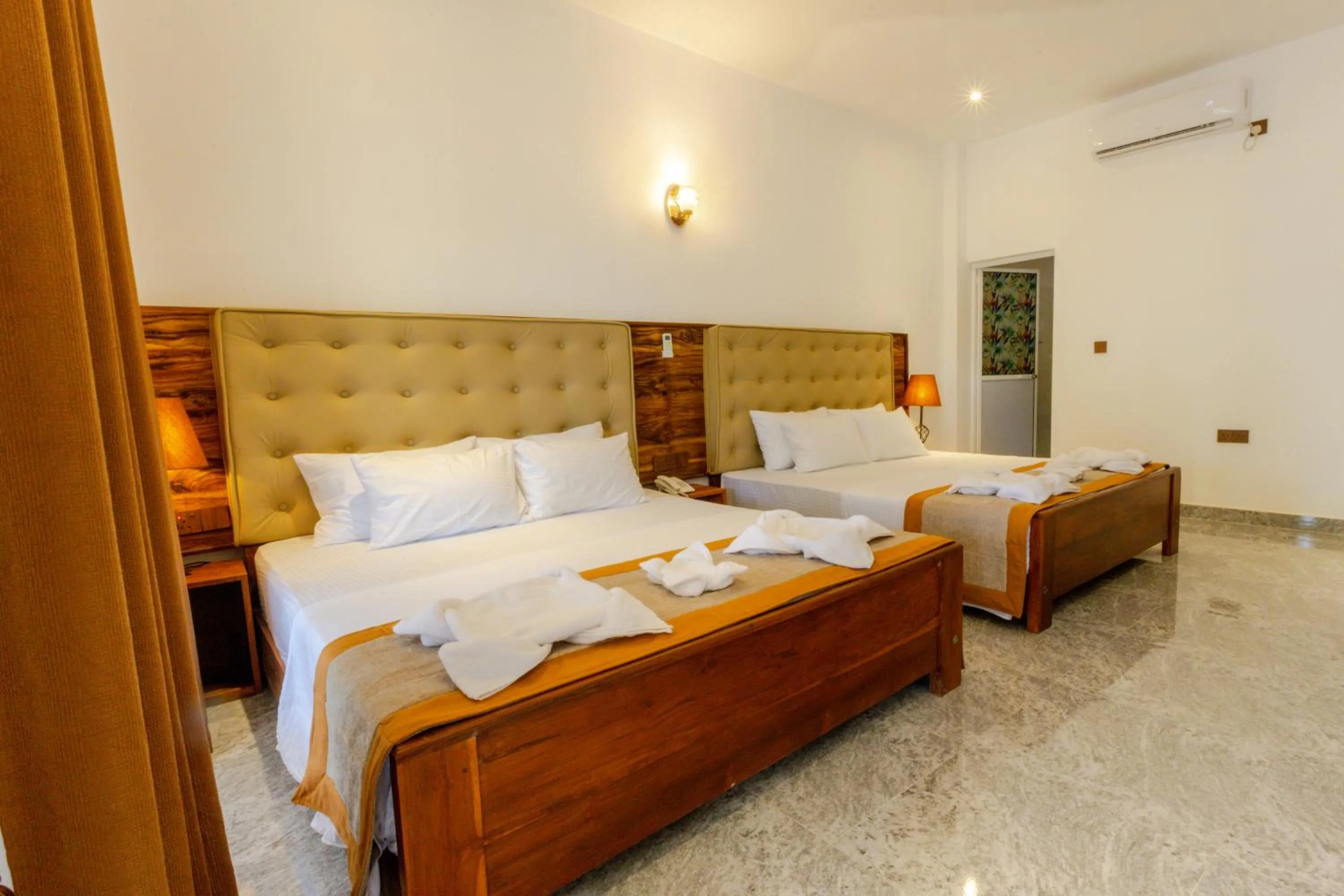 Bed in Elysia Sigiriya Hotel