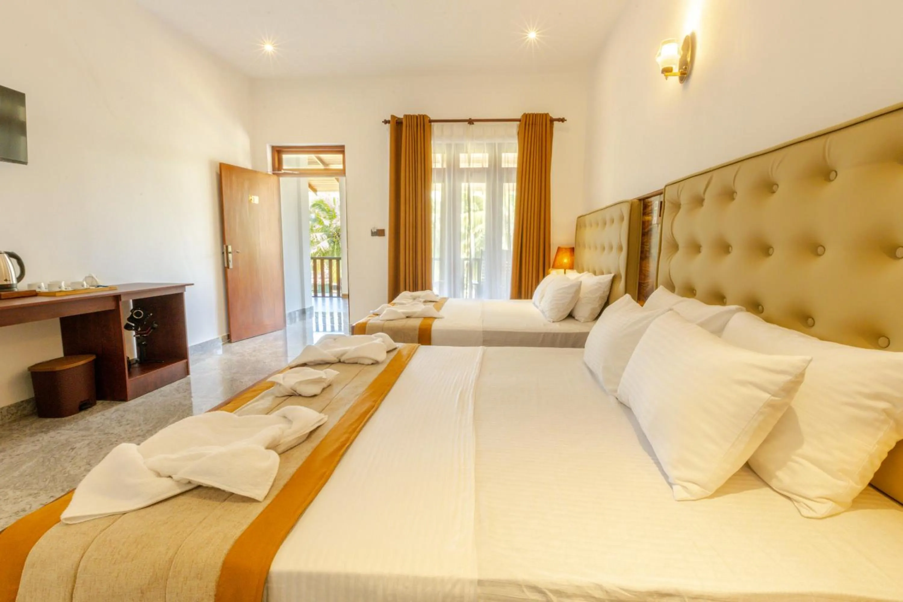 Bed in Elysia Sigiriya Hotel