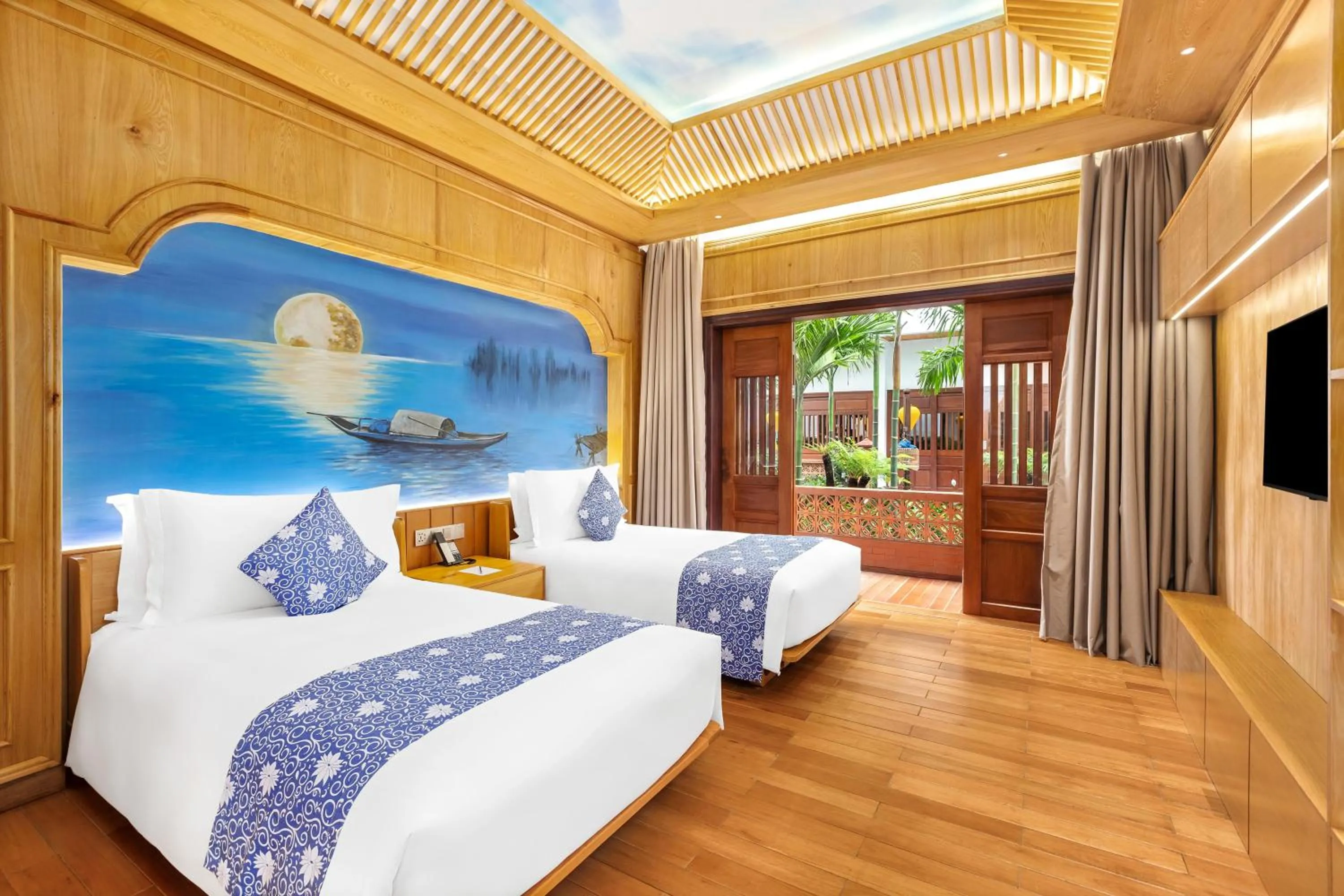 Communal lounge/ TV room, Bed in Wafaifo Resort Hoi An