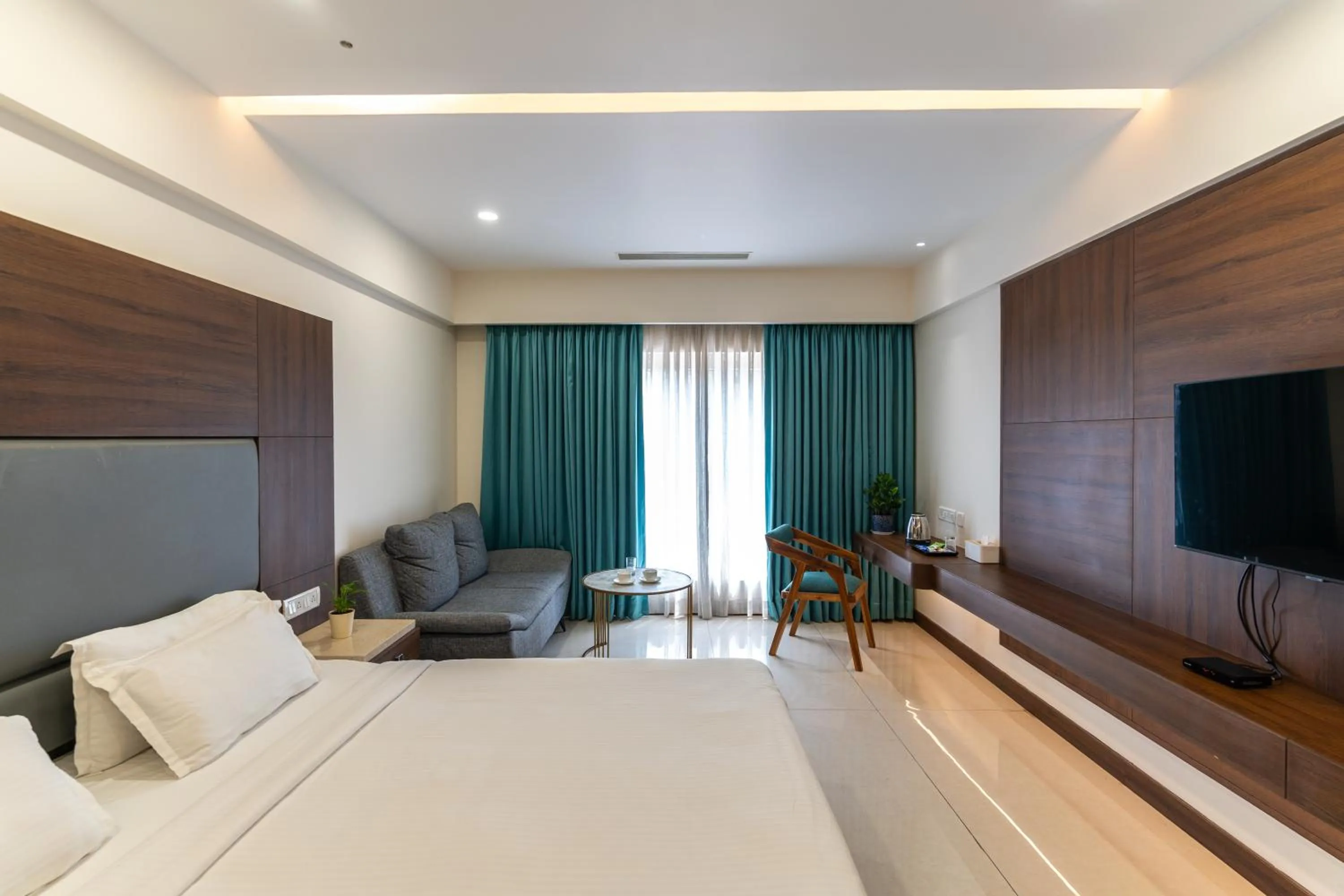 Communal lounge/ TV room, Bed in Pincode Hotels by Yatri Nivas