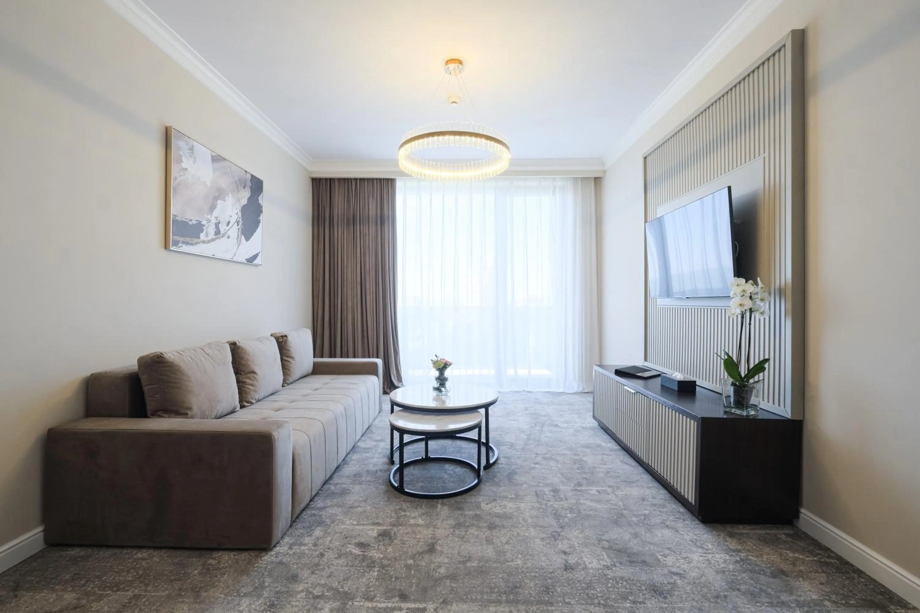 Communal lounge/ TV room in Panoramic Mamaia Hotel