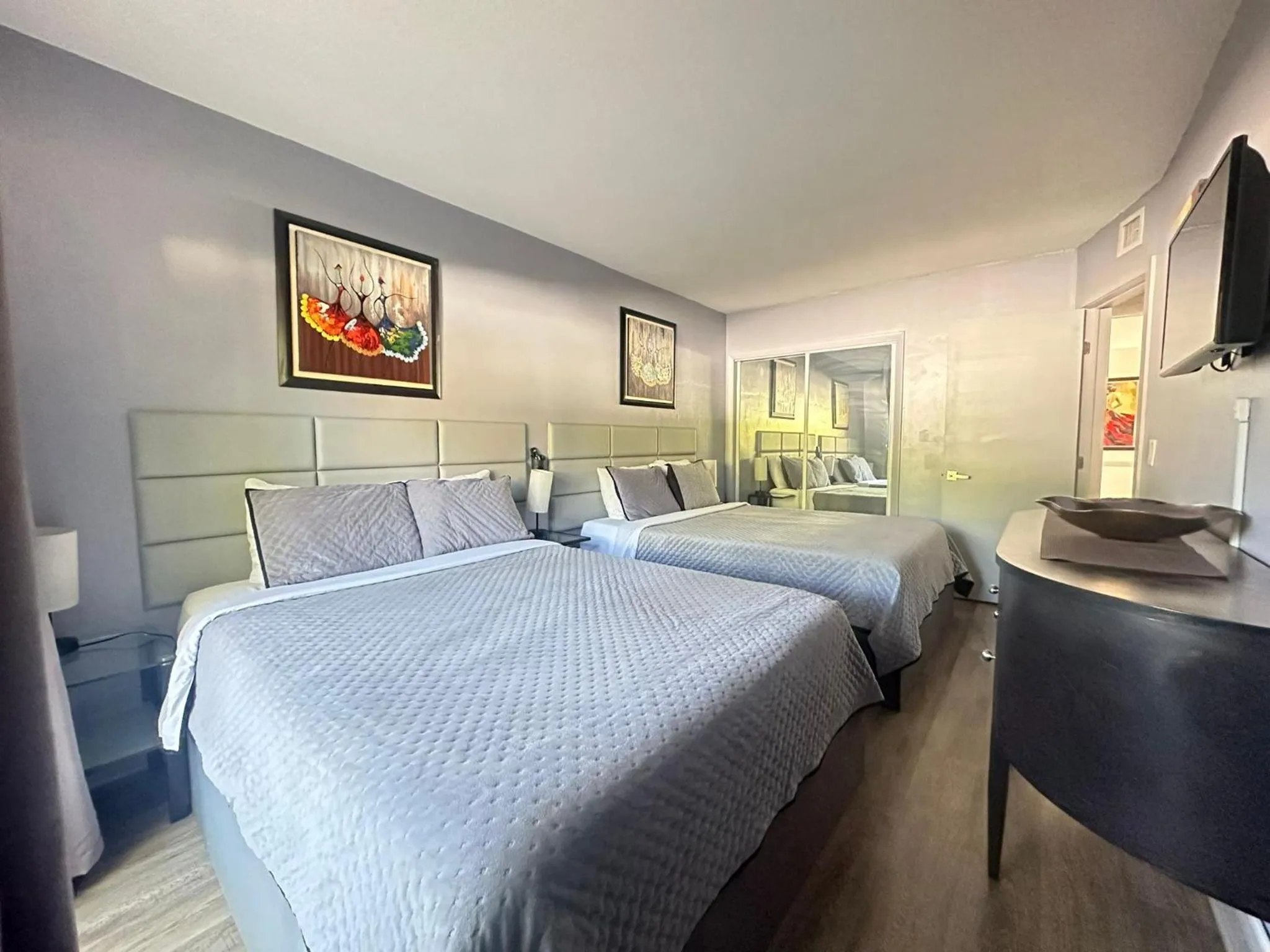 Bed in Sheridan Suites Apartments