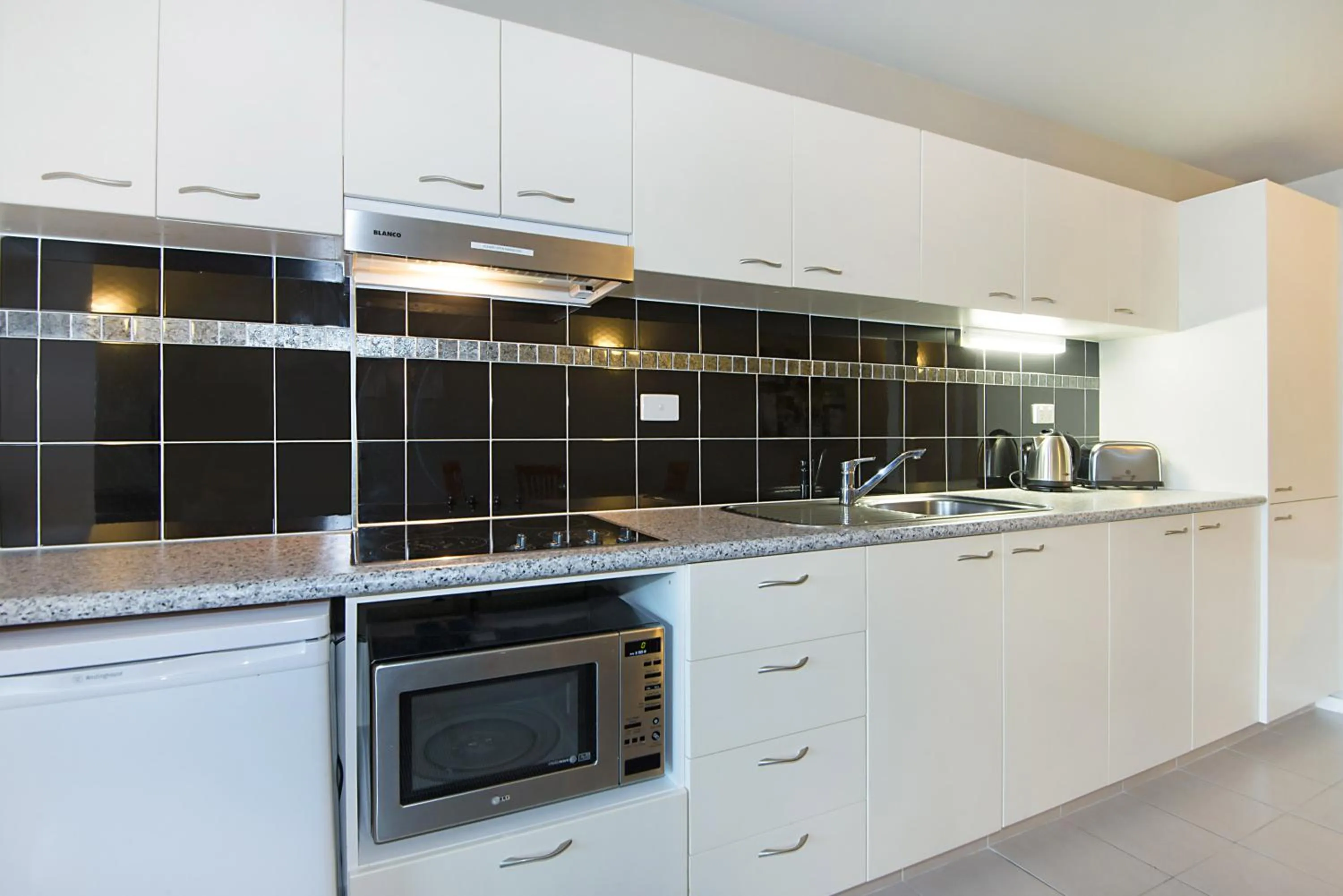 Kitchen or kitchenette in Nesuto The Entrance