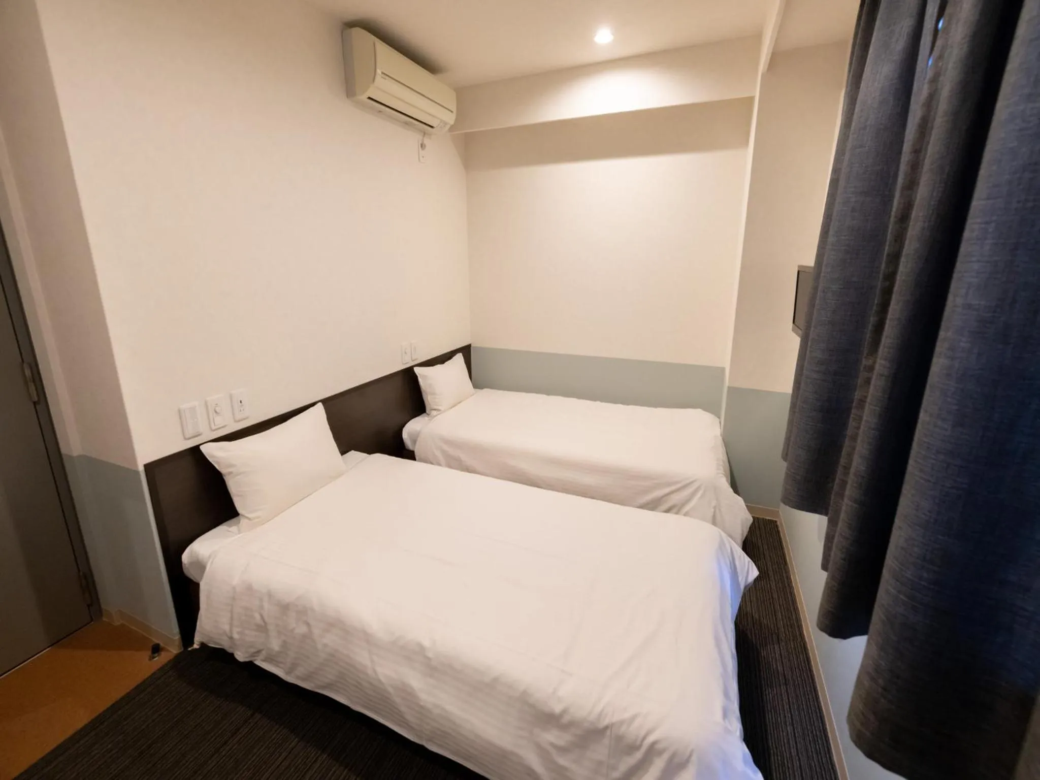 Bed in Hotel Taiyo Noen Tokushima Kenchomae