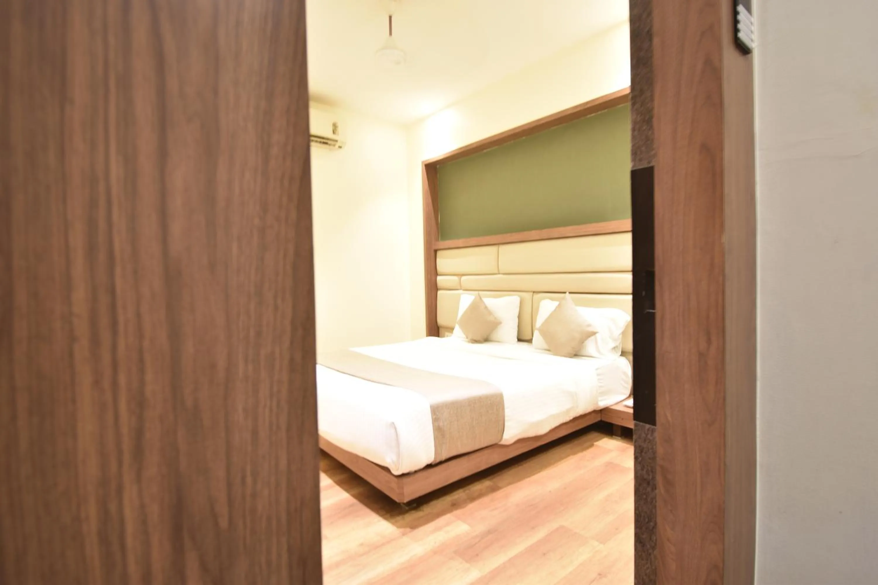Bedroom, Bed in The Aarya A Smart Business Hotel