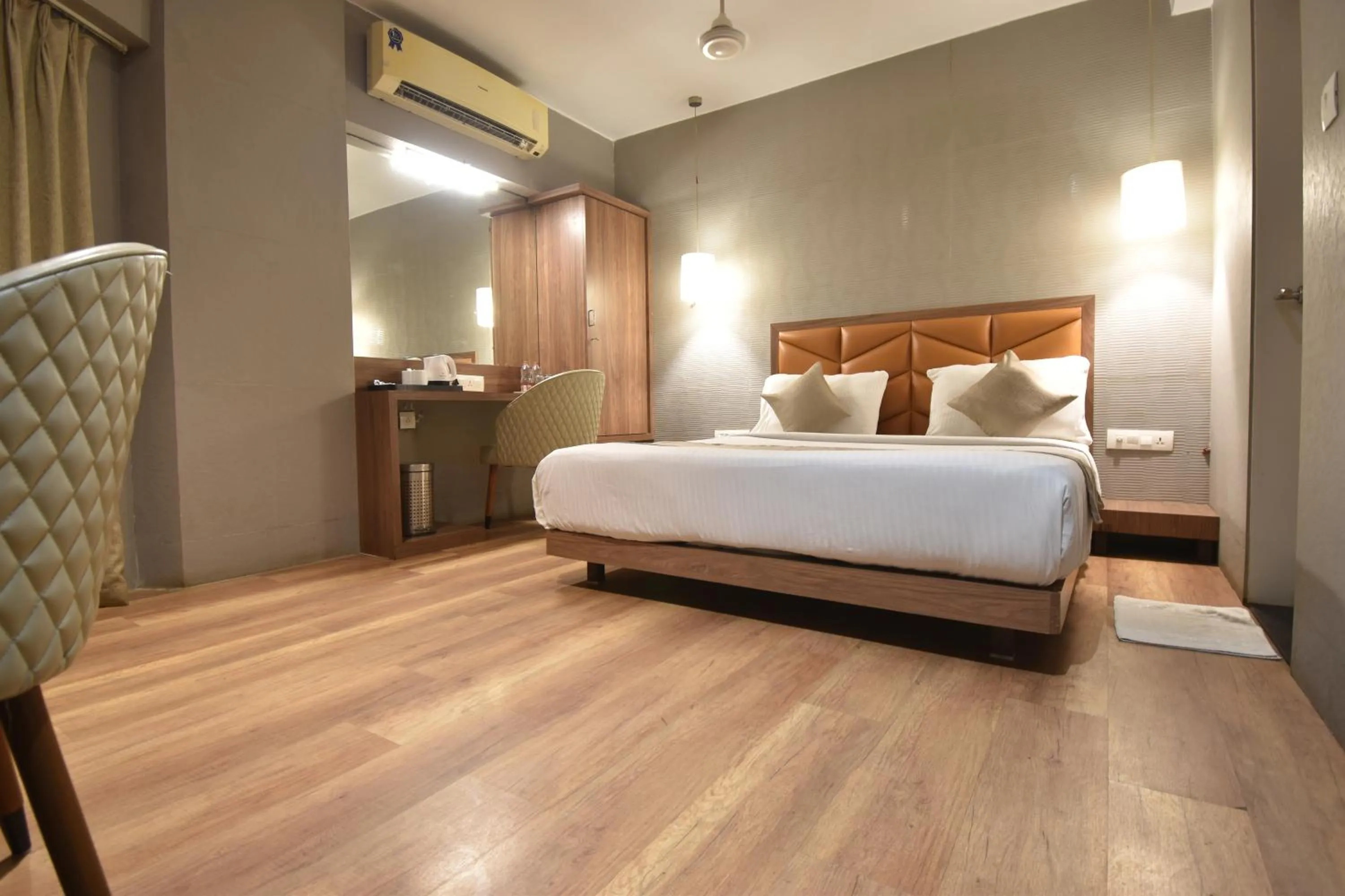 wardrobe, Bed in The Aarya A Smart Business Hotel