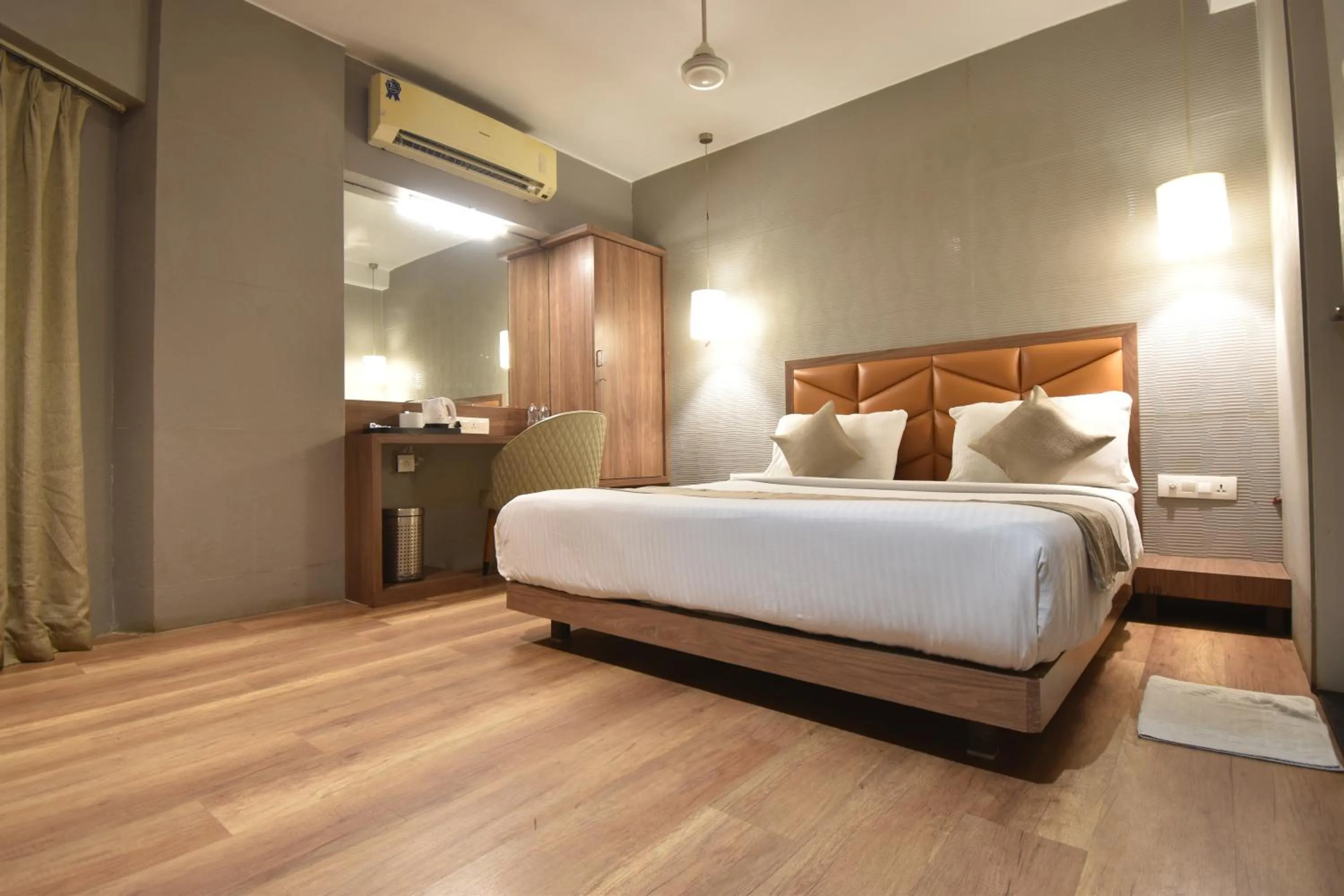 Bed in The Aarya A Smart Business Hotel