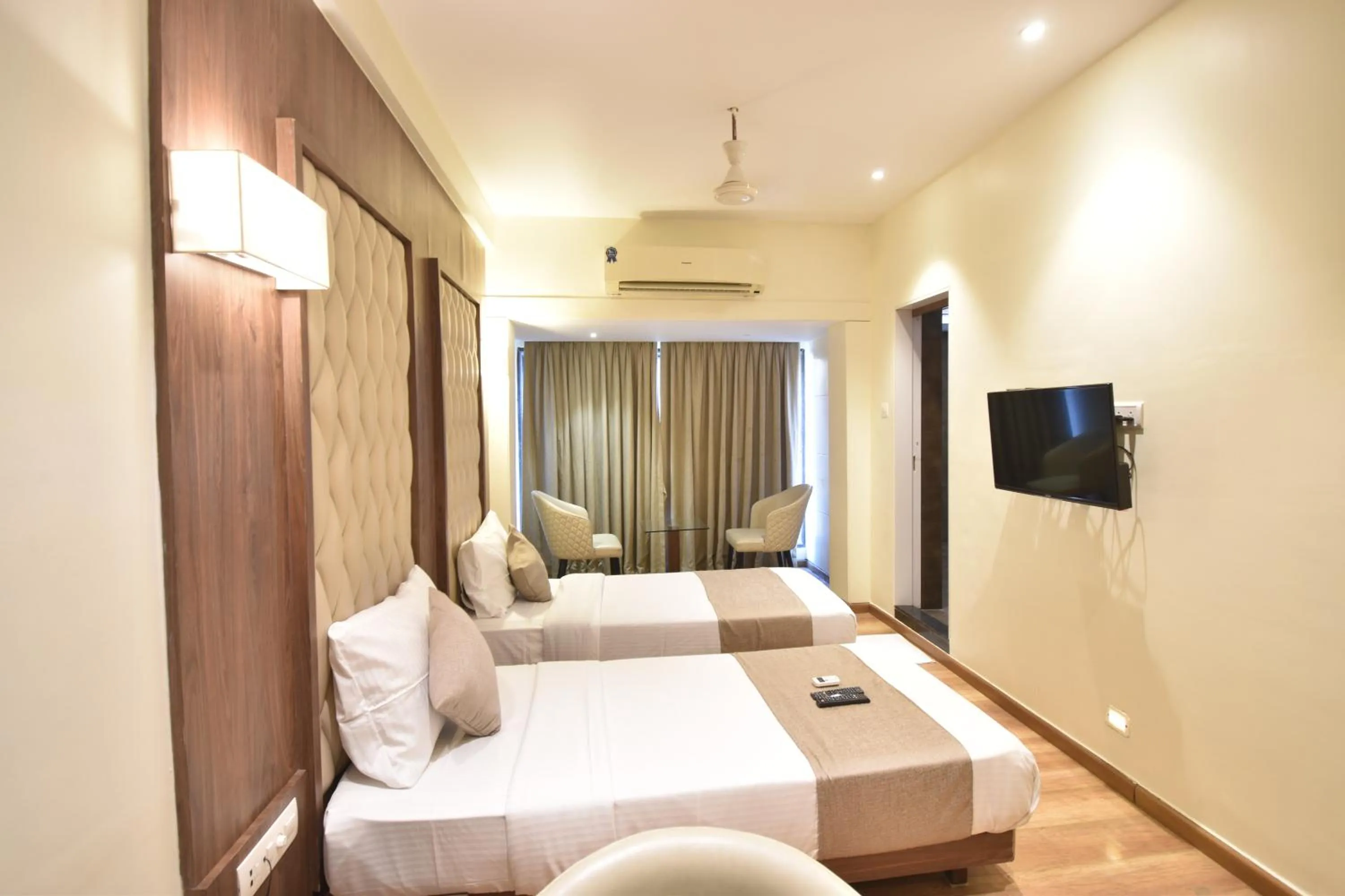 Bed in The Aarya A Smart Business Hotel