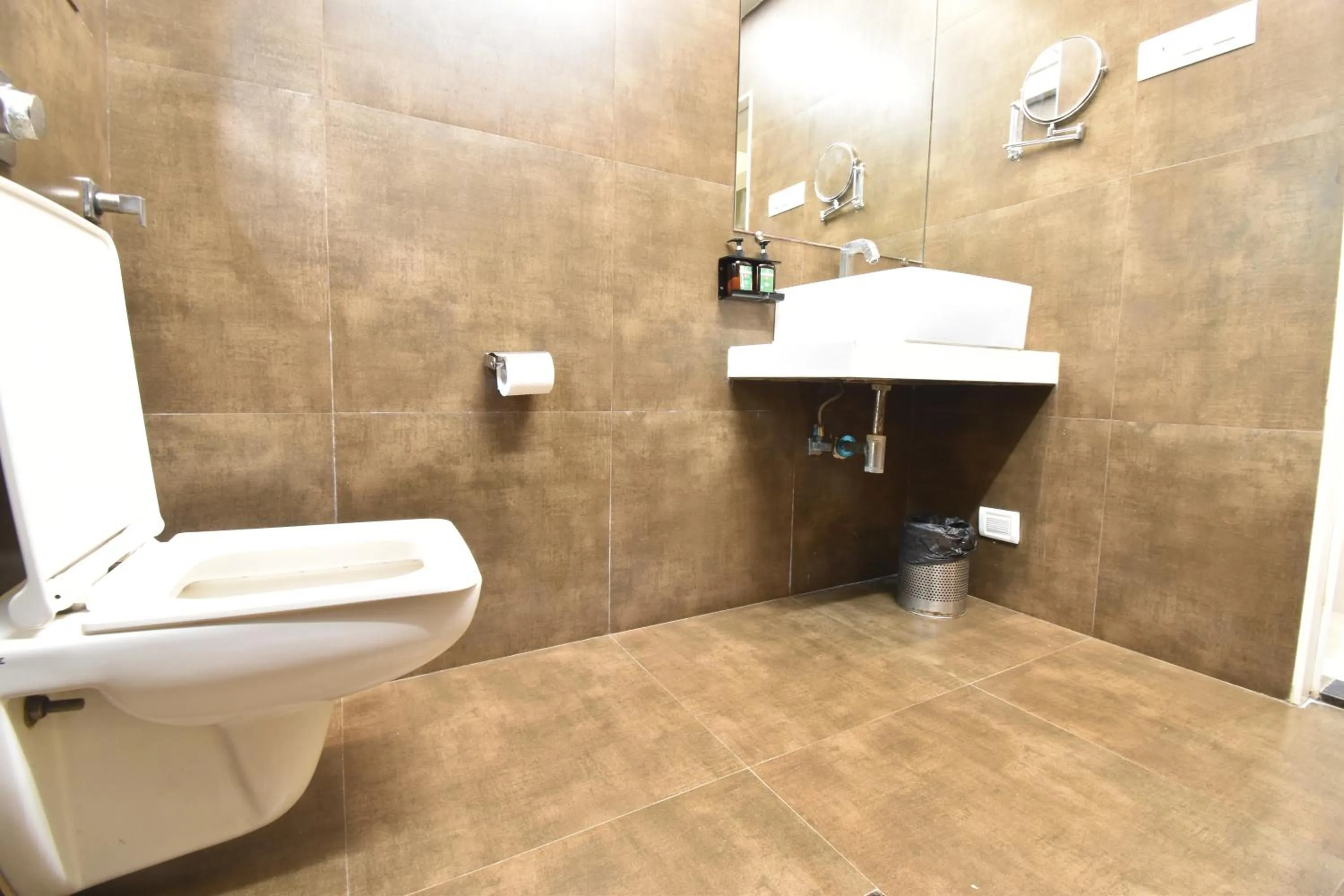 Toilet in The Aarya A Smart Business Hotel