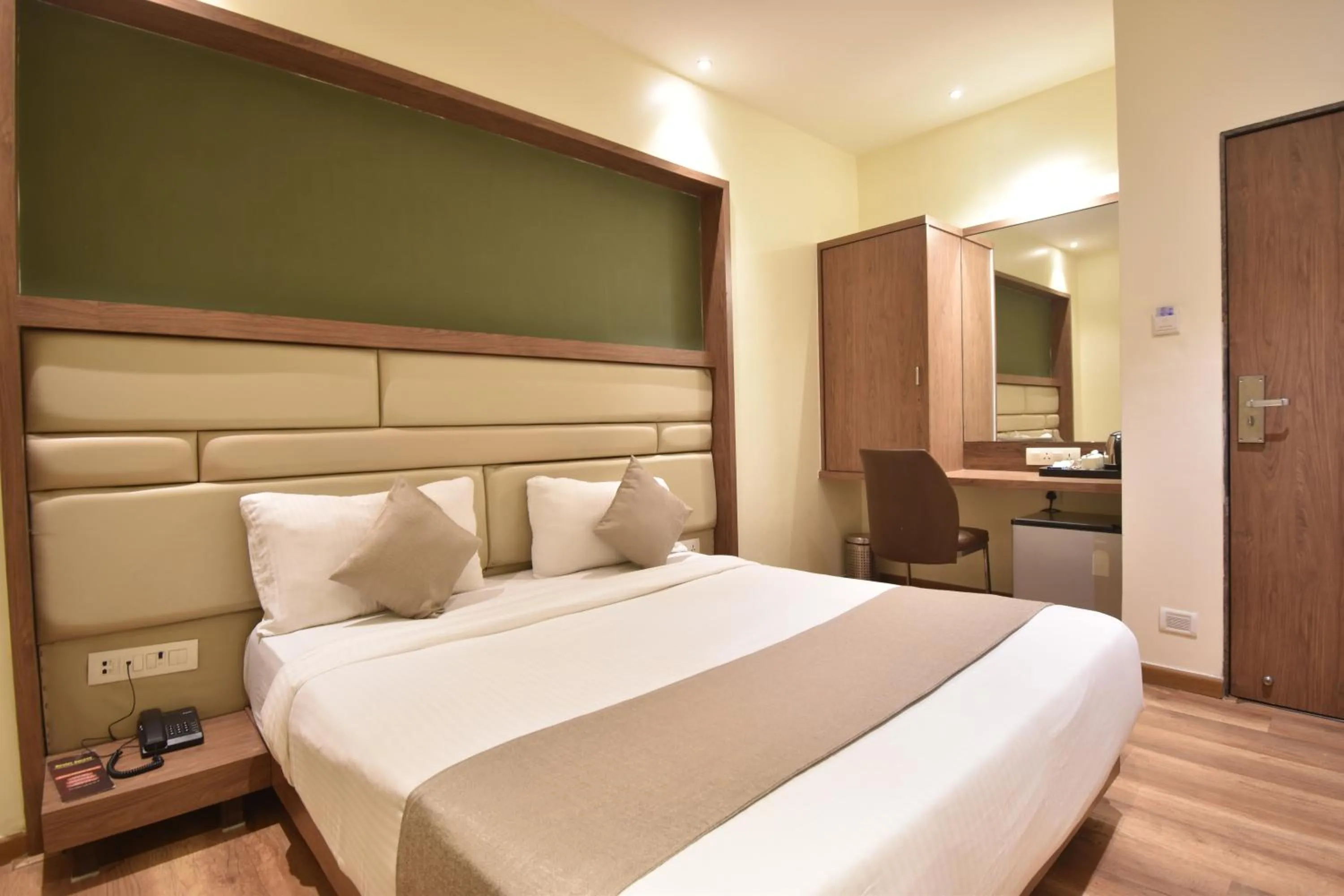 Bed in The Aarya A Smart Business Hotel