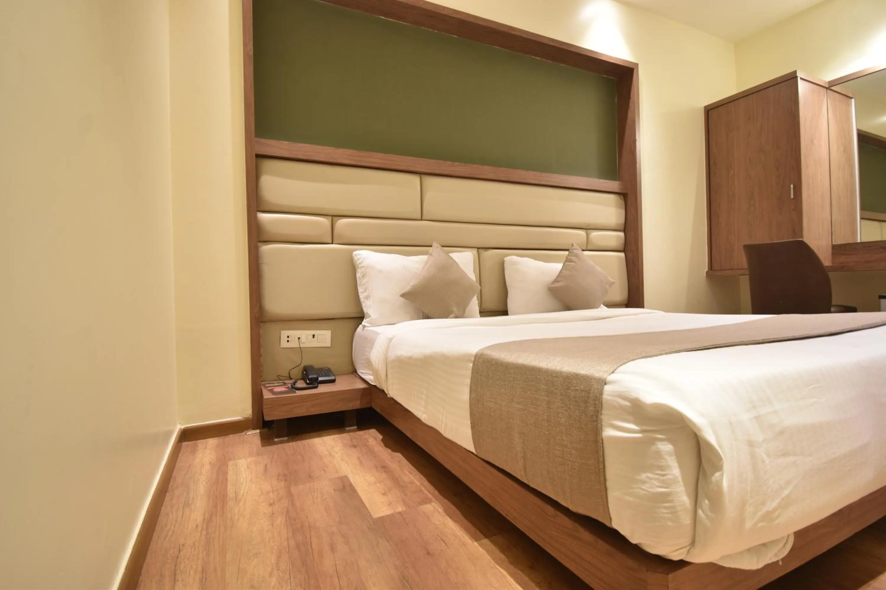Bed in The Aarya A Smart Business Hotel
