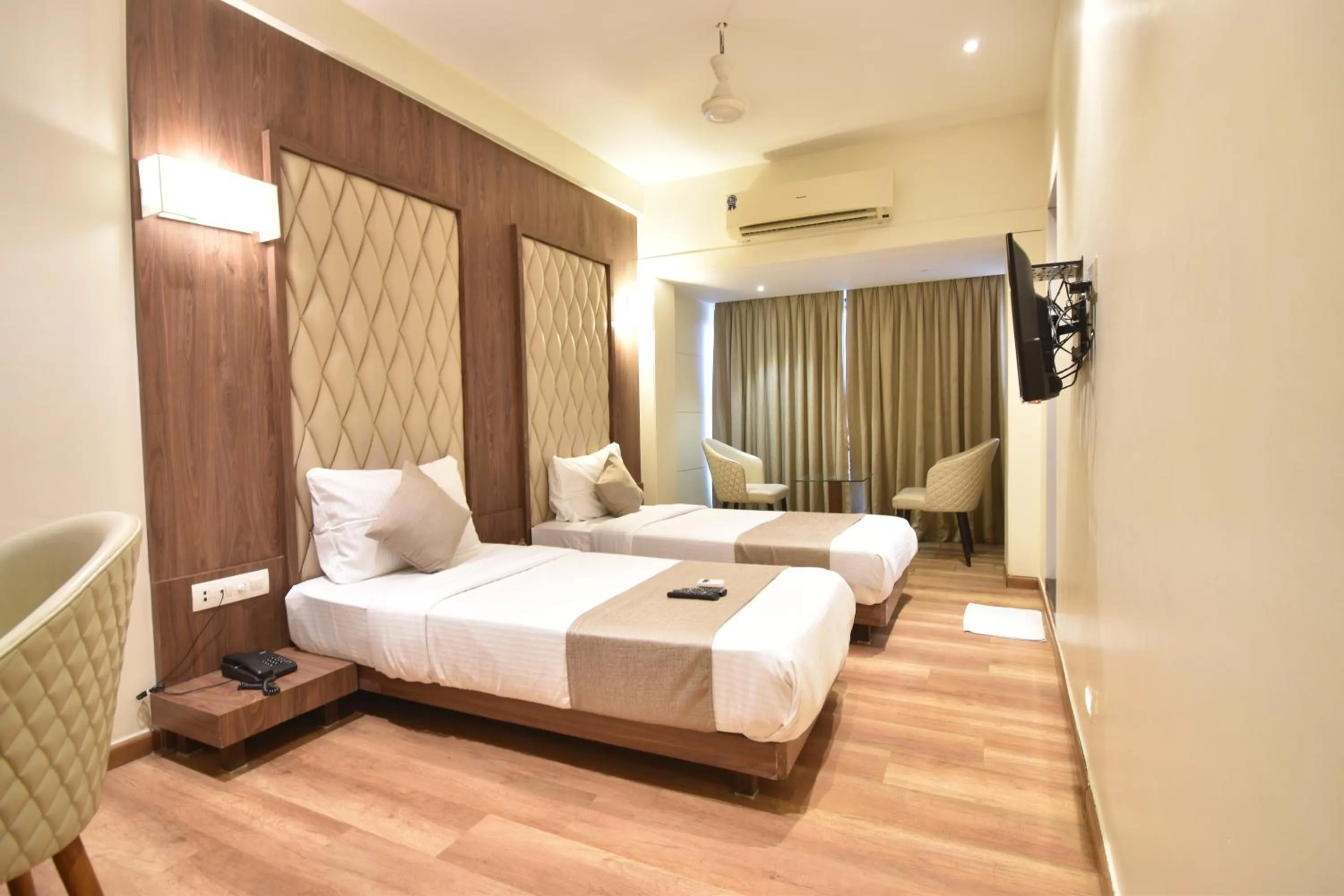 Bed in The Aarya A Smart Business Hotel